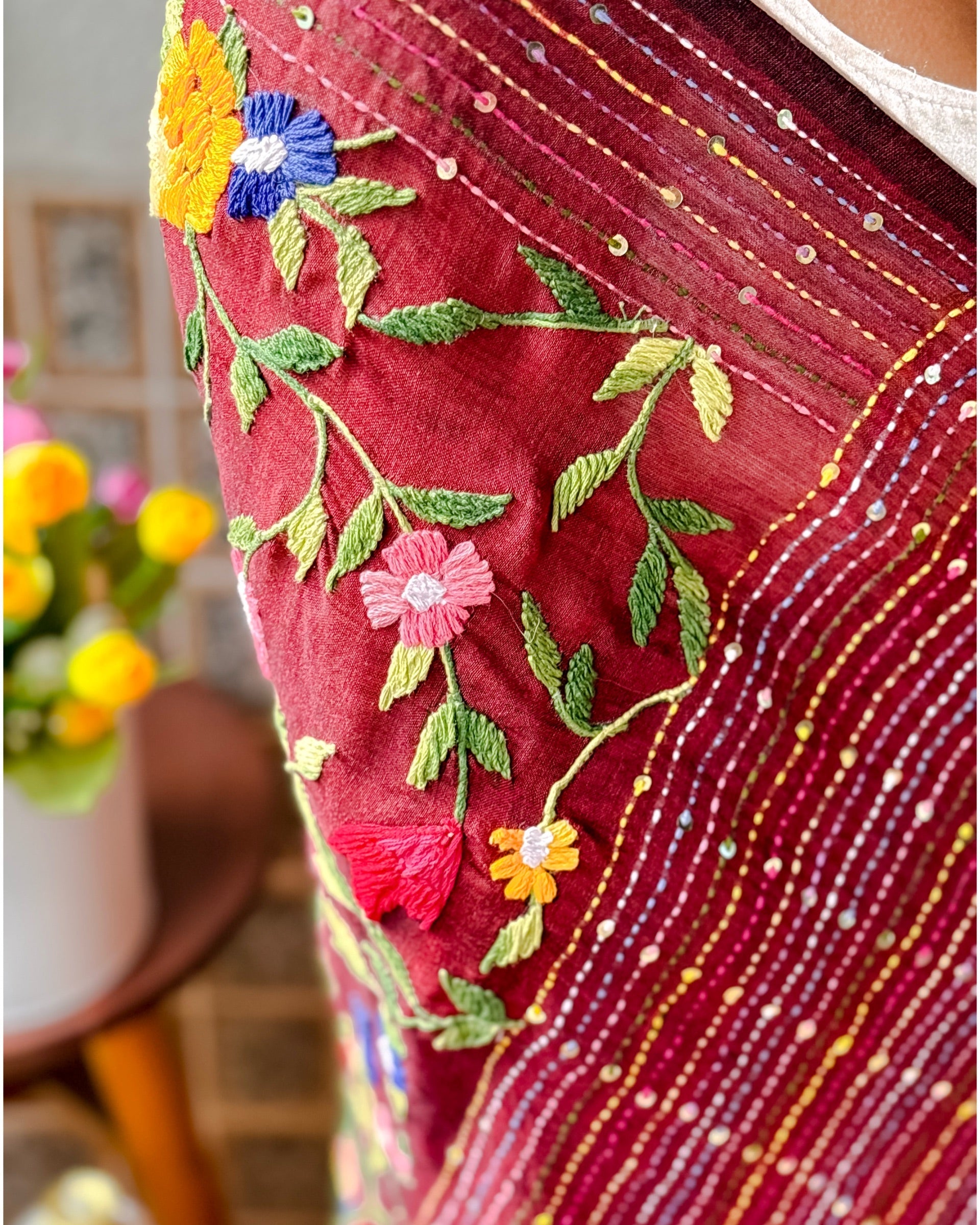 Handcrafted maroon mulmul cotton saree featuring soft breathable fabric and elegant thread work