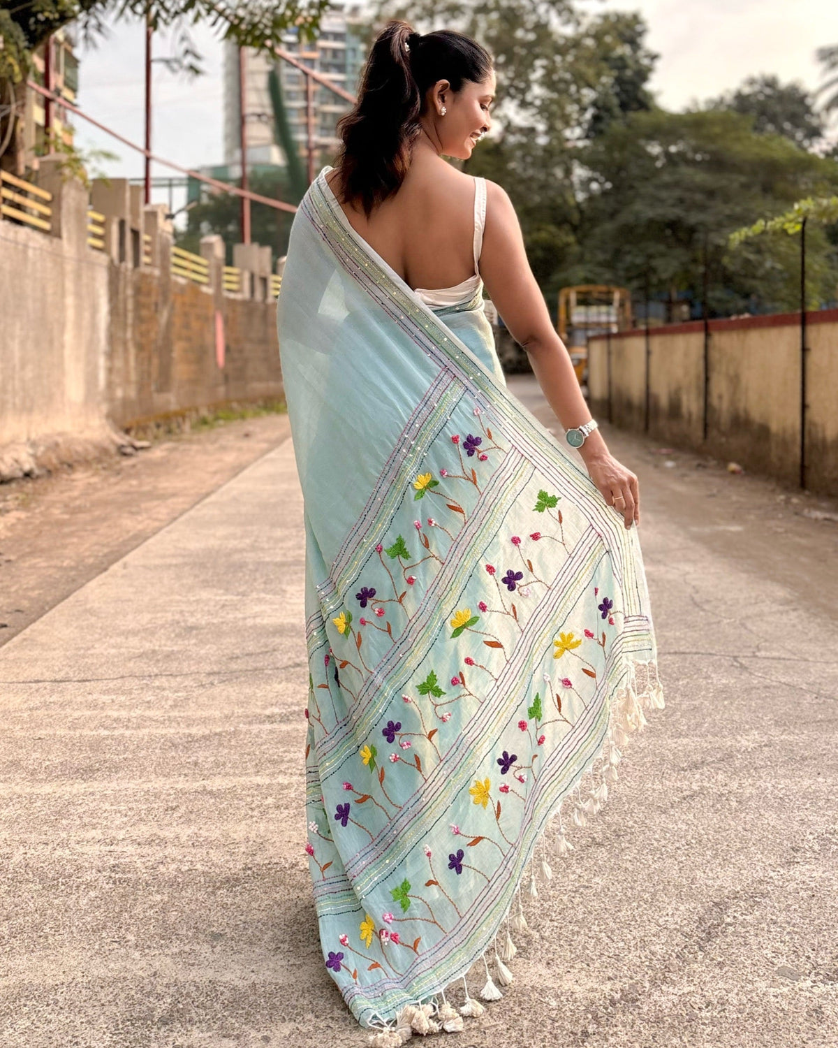 Handcrafted cyan mulmul cotton saree with artisanal embroidery