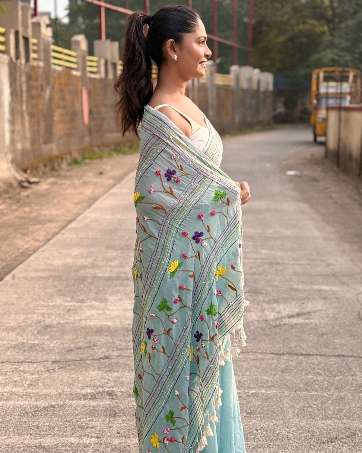 mulmul cotton saree in cyan with intricate embroidered patterns