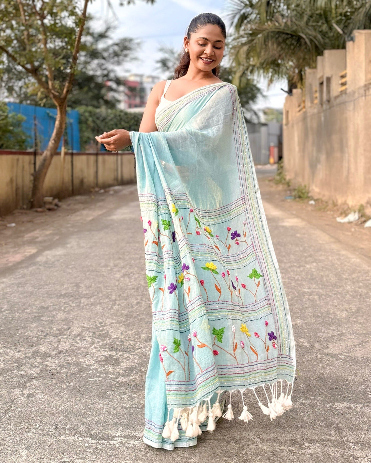 Lightweight cyan mulmul cotton saree with traditional hand embroidery