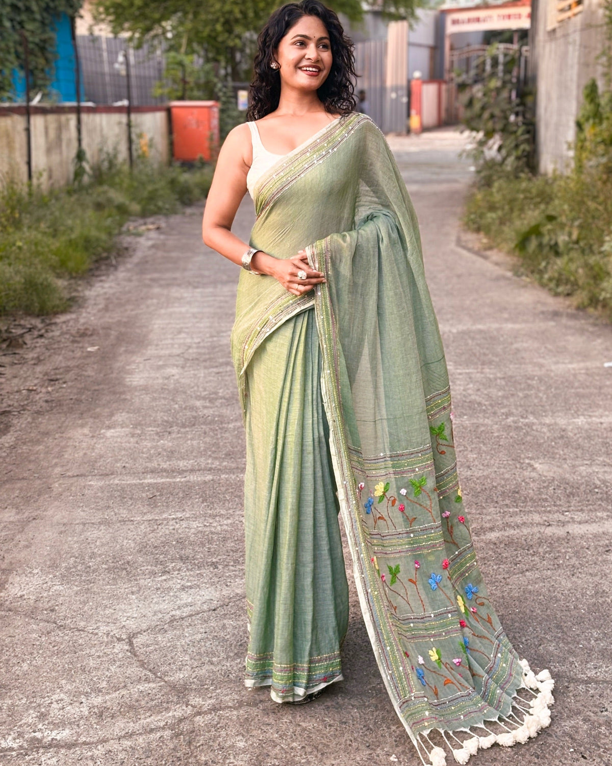Soft green cotton mulmul saree with subtle embroidery details