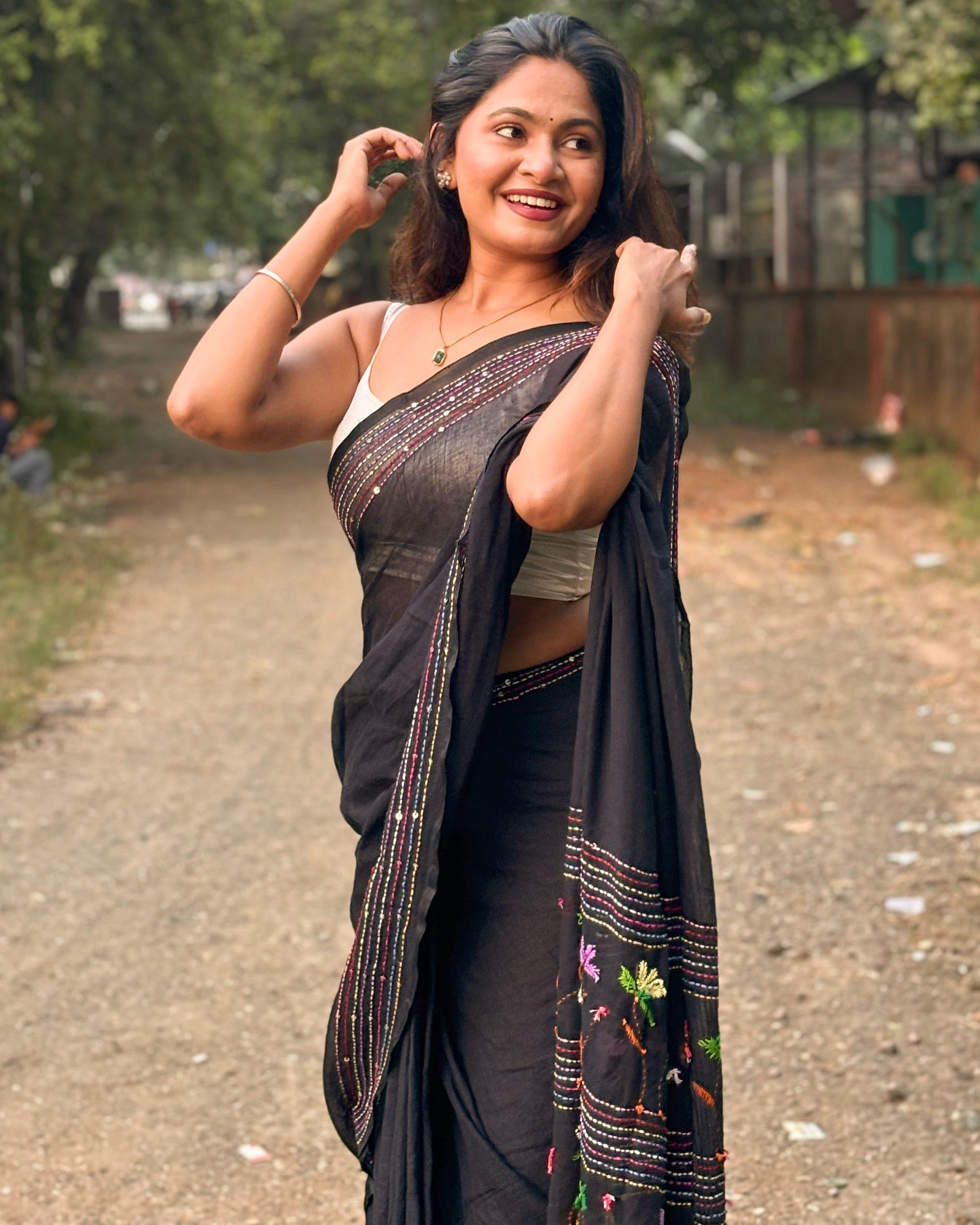 Noir Petal Nocturne black embroidered mulmul saree with elegant handcrafted detailing
