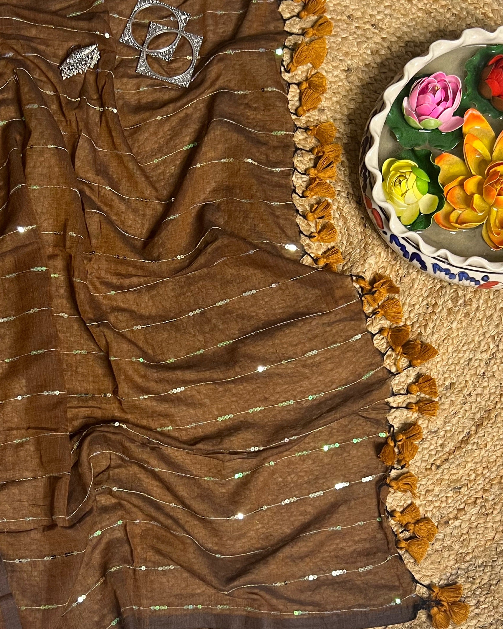 Sequins embellished brown cotton saree featuring graceful ethnic appeal
