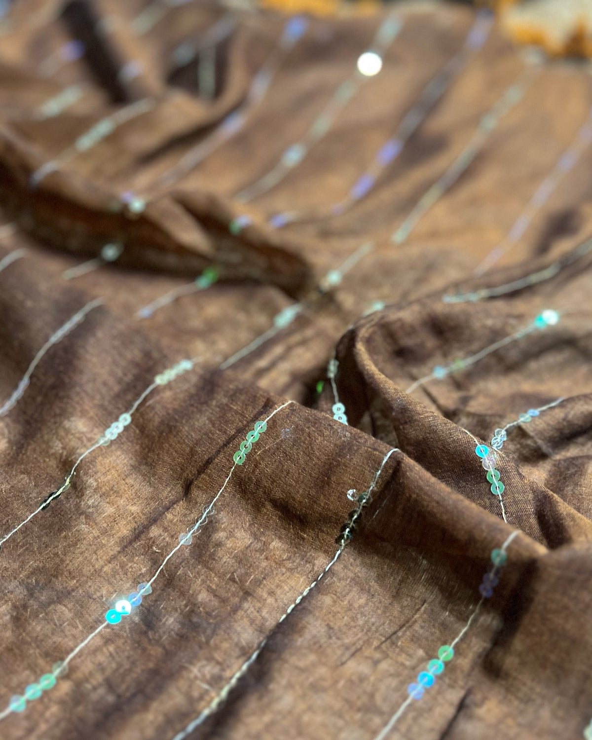 Designer brown mulmul cotton saree with sequins detailing for parties and evening wear
