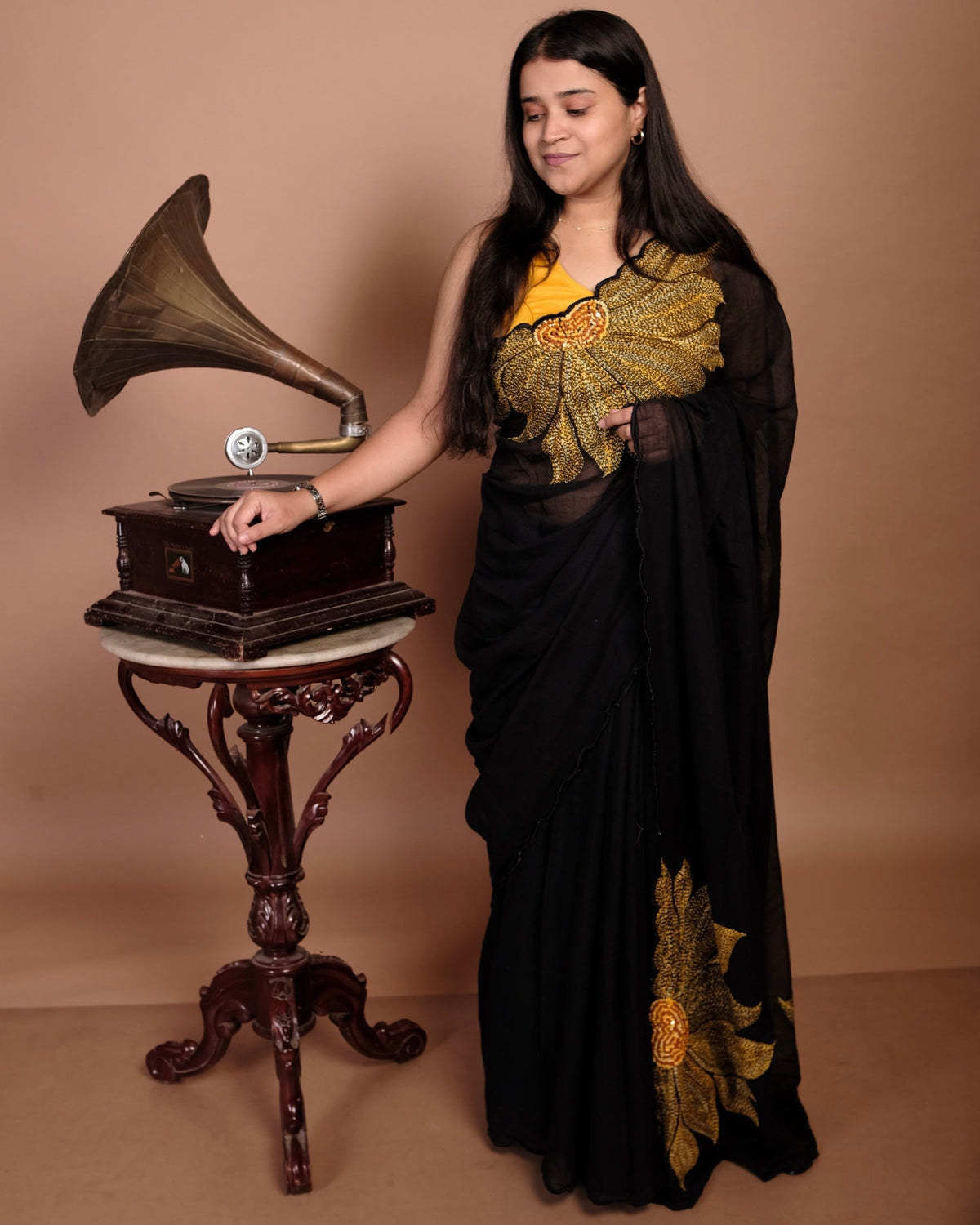 Soft and comfortable light weight black mulmul cotton Shopaame saree with sunflower embroidery sequins embellished. Good for day time wear festive party wear