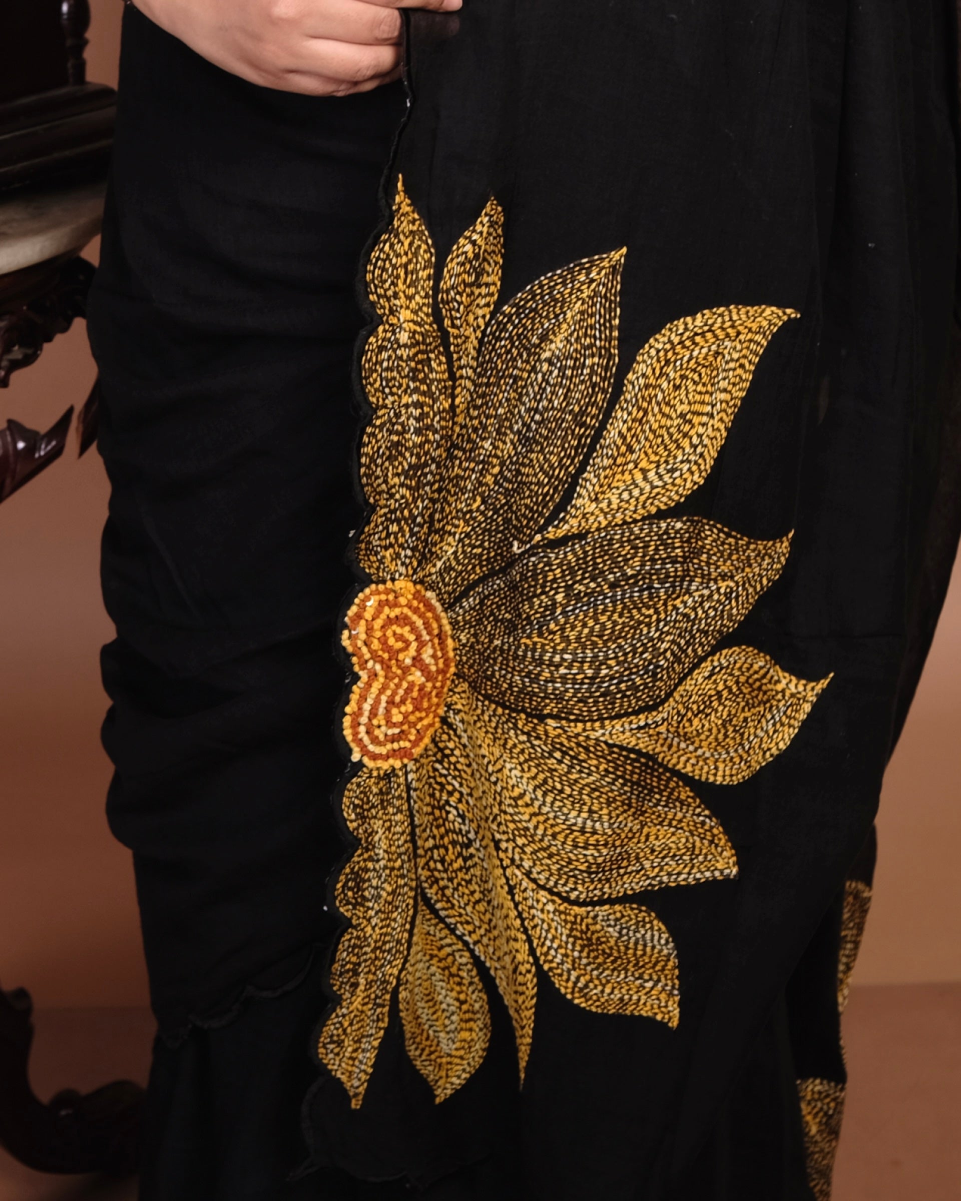 Soft and comfortable light weight black mulmul cotton saree by Shopaame with sunflower embroidery sequins embellished good for festive party wear
