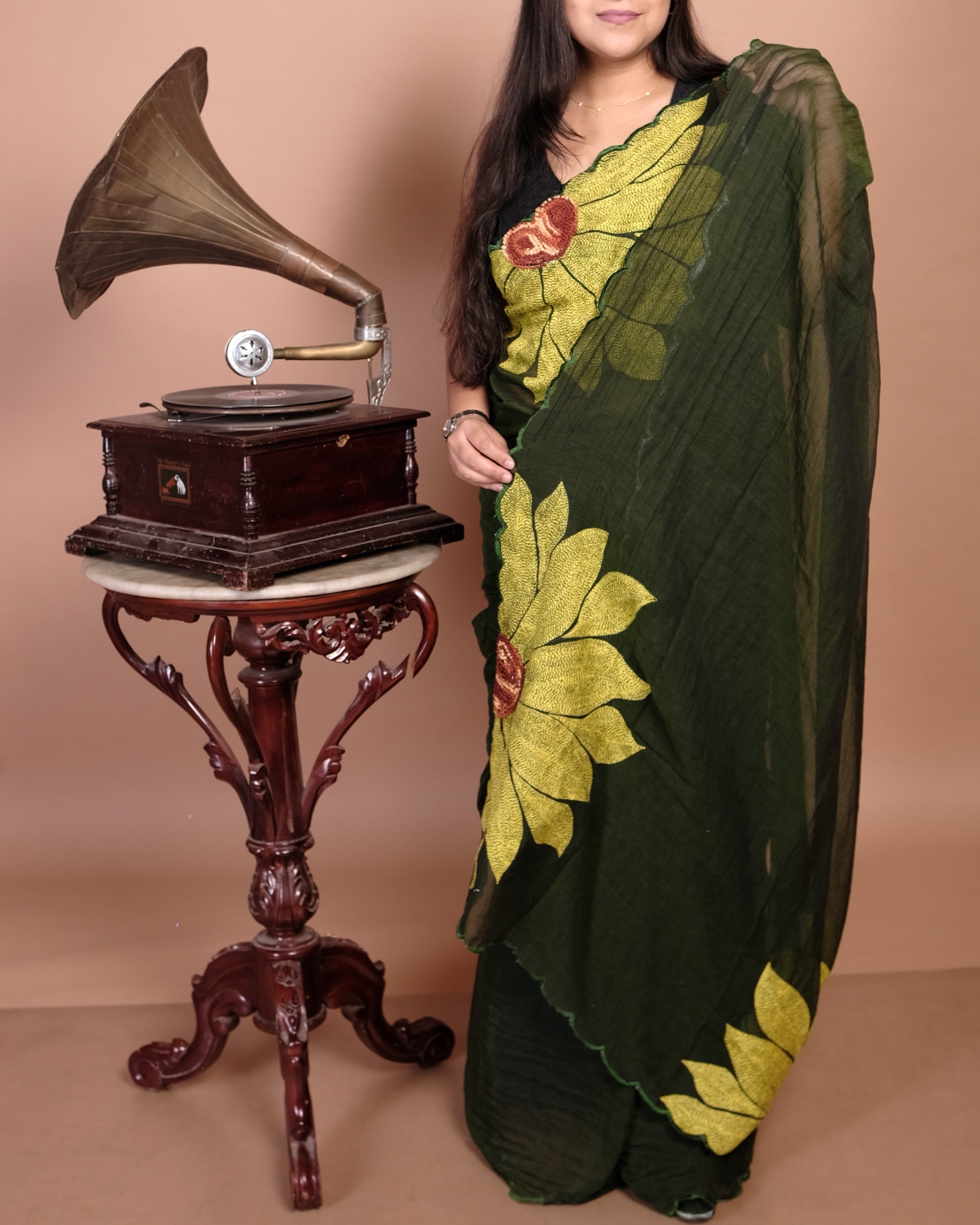 Lightweight green embroidered mulmul cotton saree, designed for soft comfort and effortless summer elegance.
