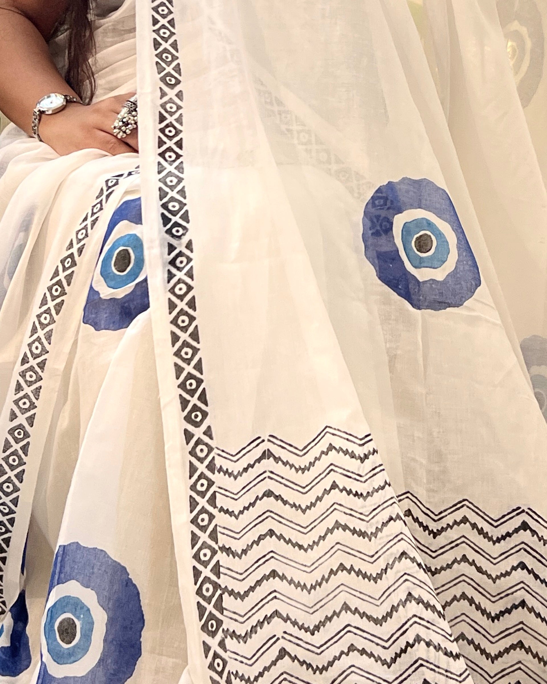Soft & Comfortable white mulmul saree with handblock print in blue evil eye pattern