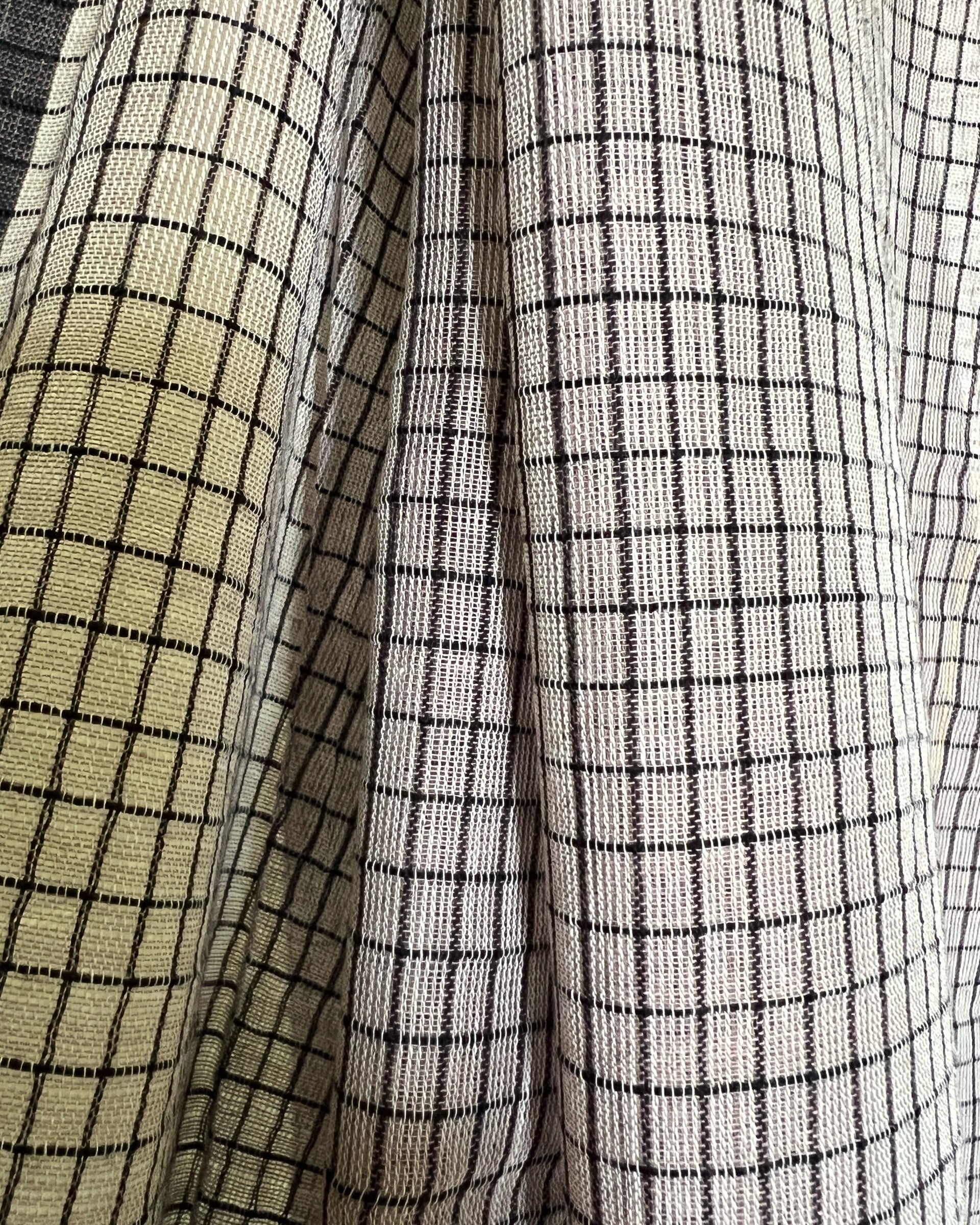 Close-up of brown checkered saree by Shopaame