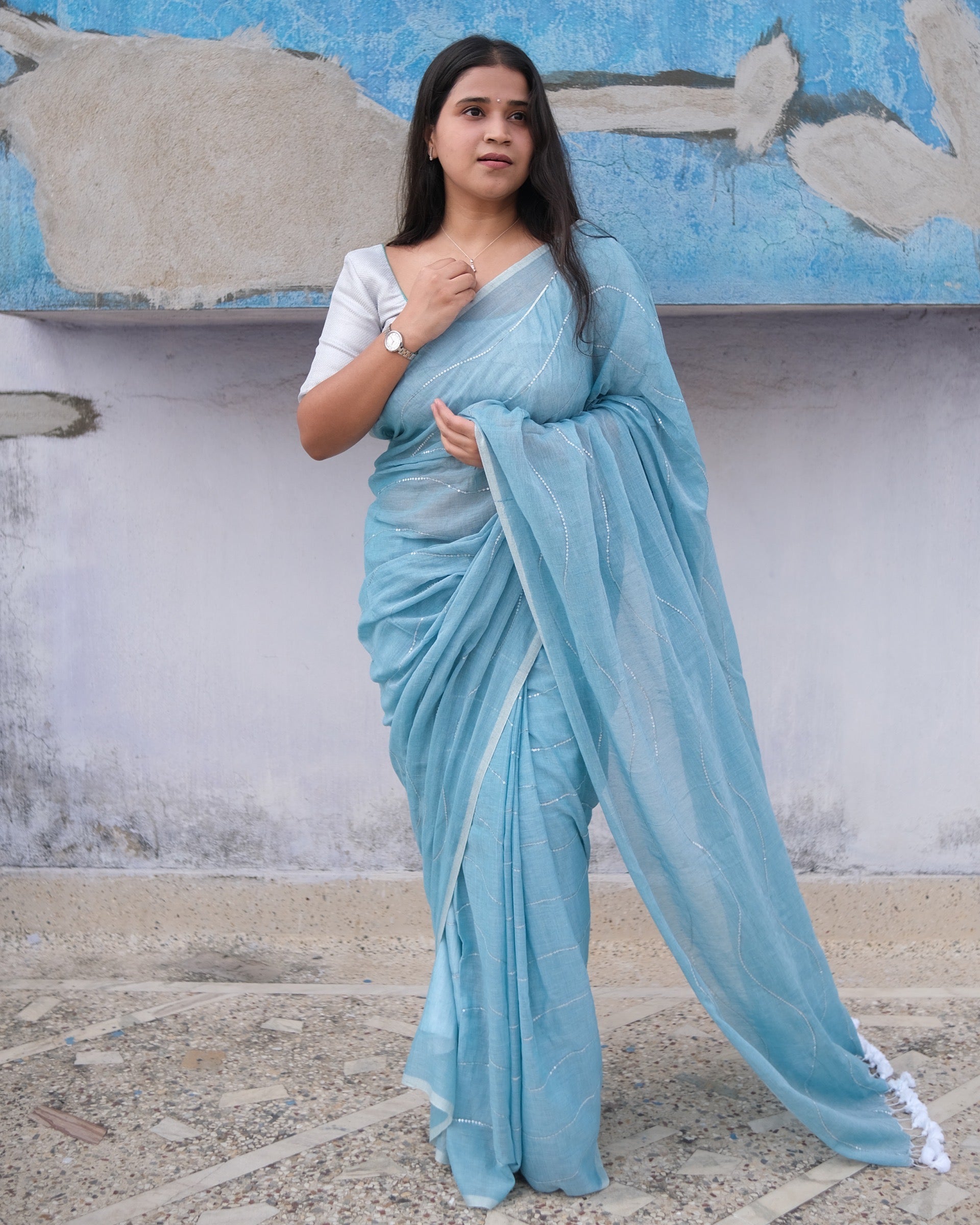 Soft and Comfortable mulmul cotton saree in sky blue shade with sequin emblishment for festive or party wear at reasonable price