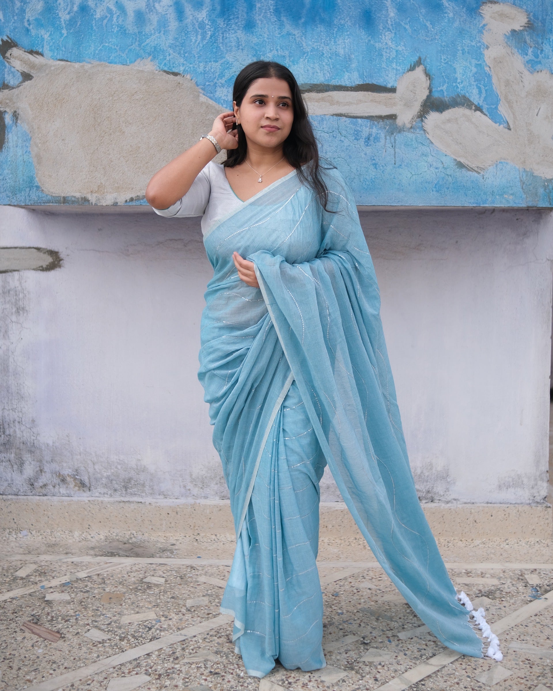 Soft and Comfortable mulmul cotton saree in sky blue shade with sequin emblishment for festive or party wear at reasonable price