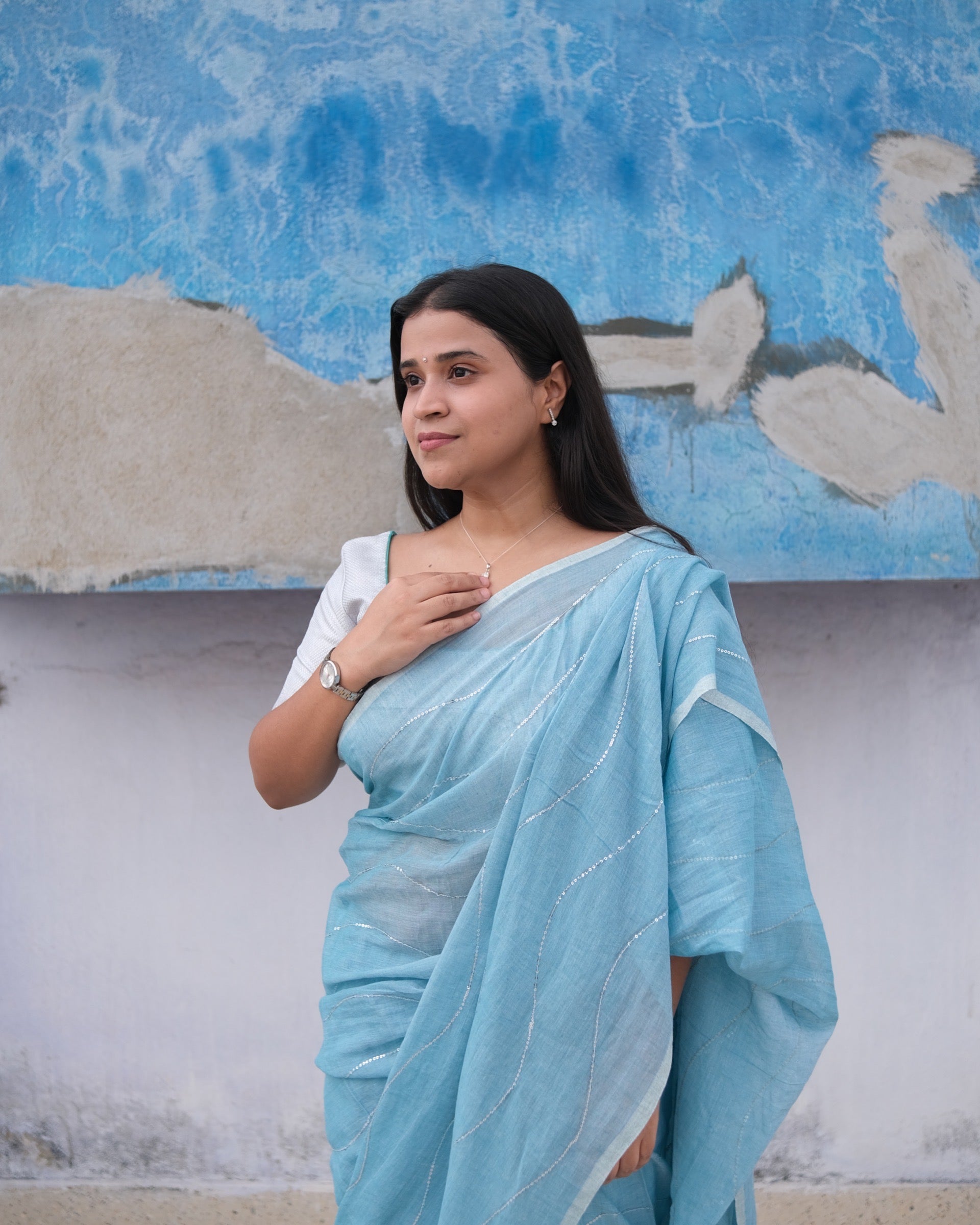 Soft and Comfortable mulmul cotton saree in sky blue shade with sequin emblishment for festive or party wear at reasonable price