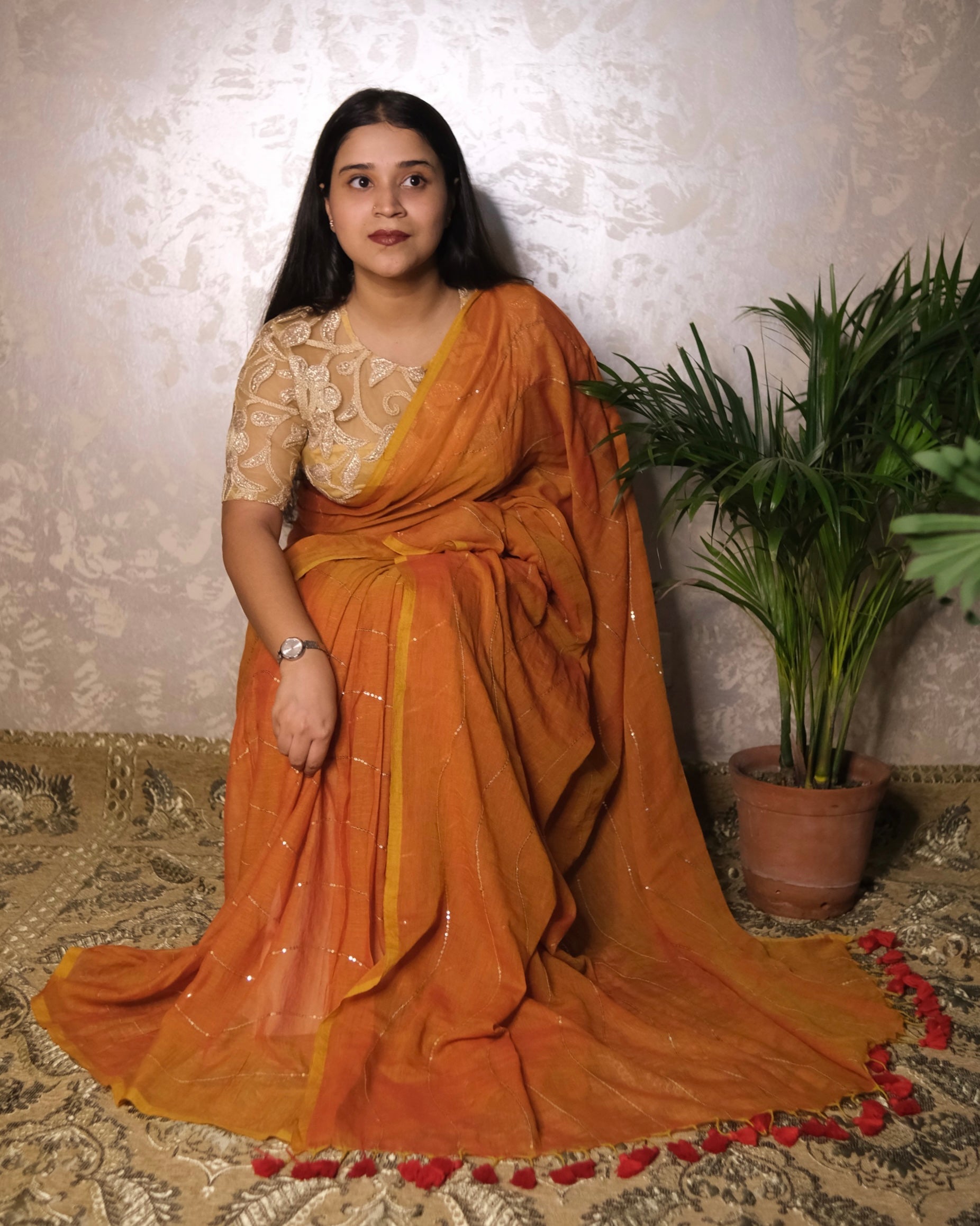 Soft and Comfortable mulmul cotton saree in dual tone mustard and orange shade with sequin emblishment for festive or party wear at reasonable price