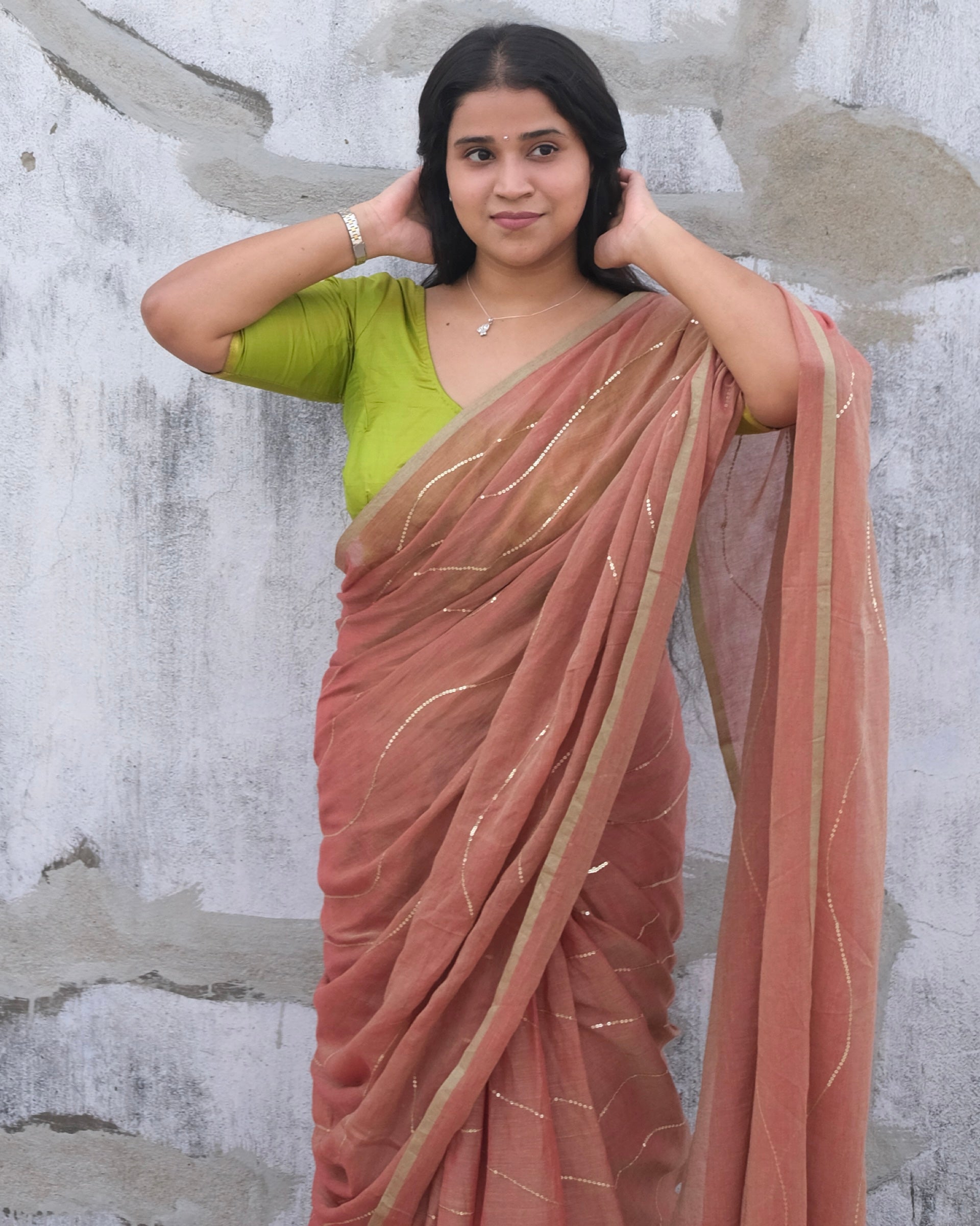 Soft and Comfortable mulmul cotton saree in dual tone peach and green shade with sequin emblishment for festive or party wear at reasonable price