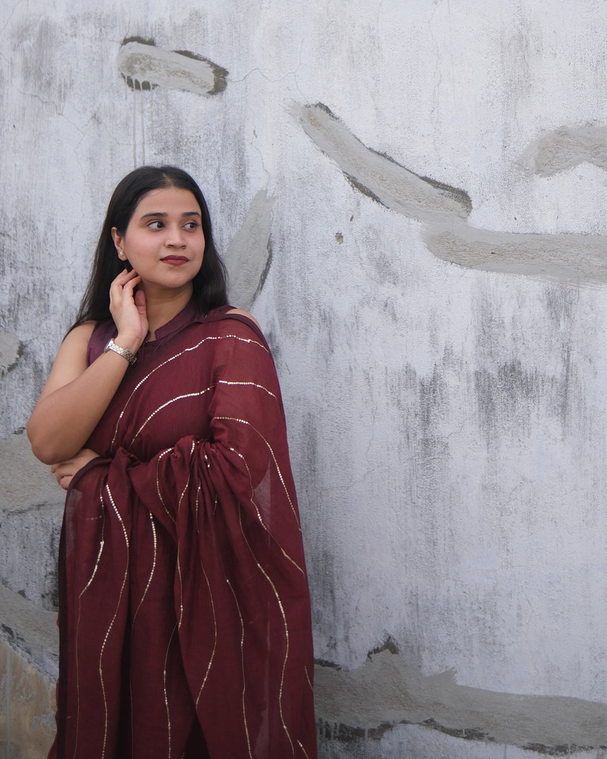 Soft and Comfortable mulmul cotton saree in maroon red shade with sequin emblishment by Shopaame for festive or party wear.