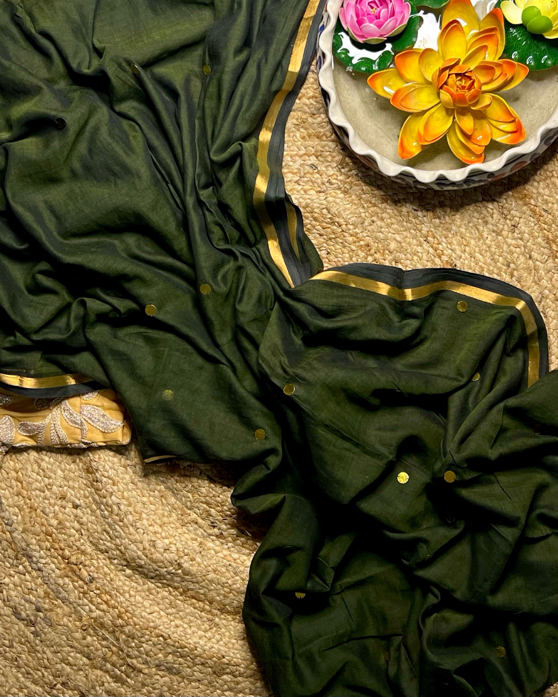 Soft and Comfortable mulmul cotton saree in green shade with golden sequin emblishment for festive or party wear at reasonable price