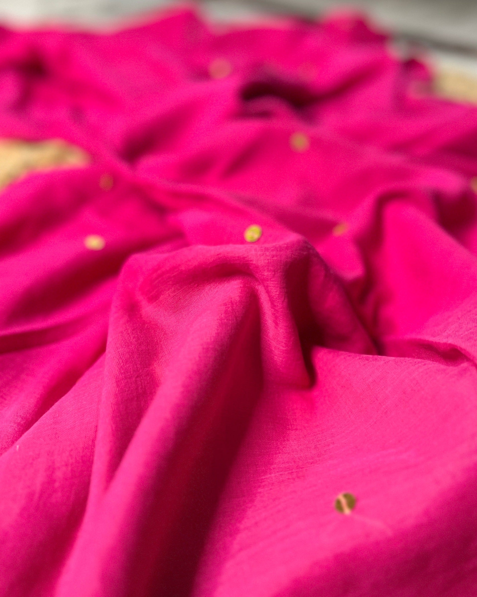 Soft and Comfortable mulmul cotton saree in rani pink shade with golden sequin emblishment for festive or party wear at reasonable price