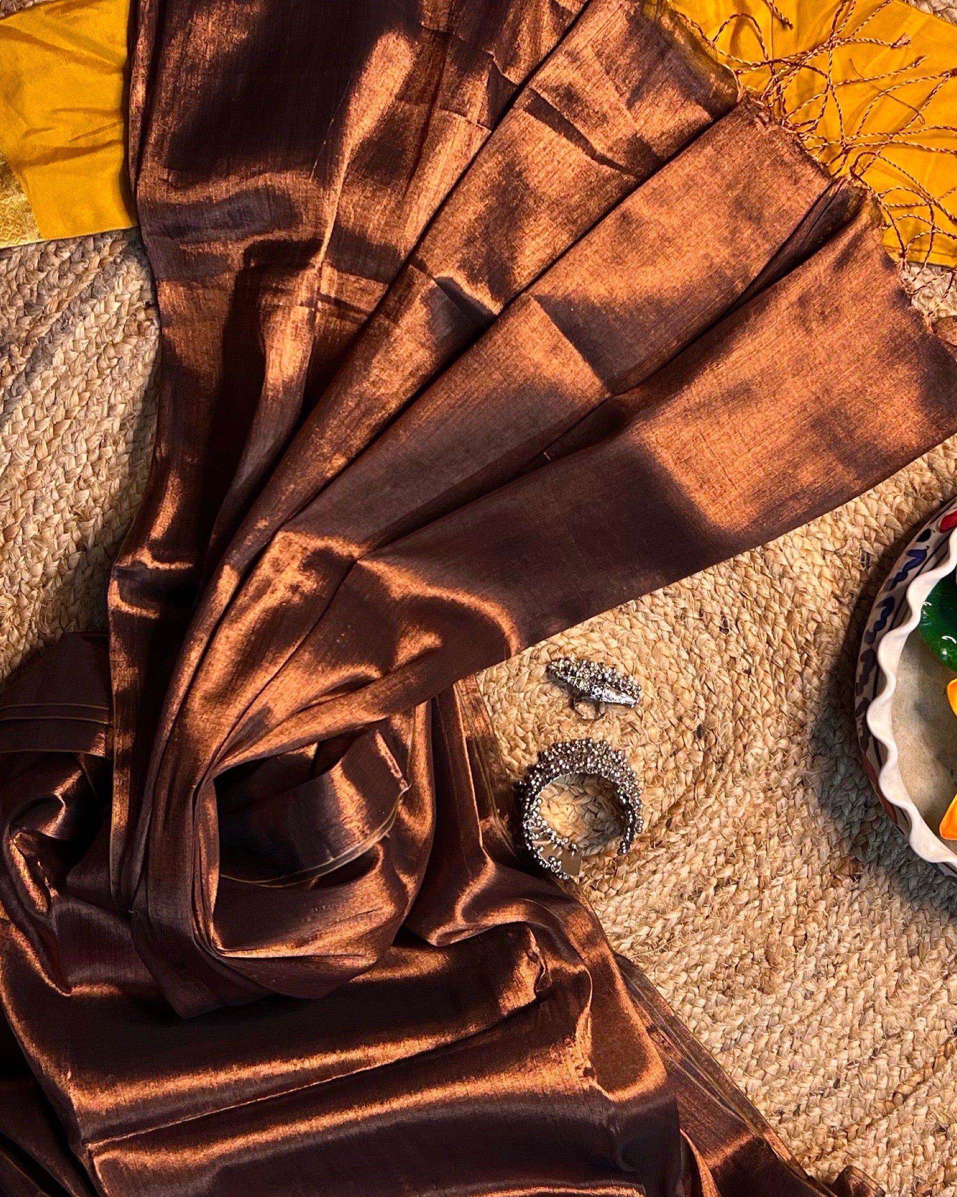 Mulmul tissue saree featuring metallic finish for celebrations and festive wear