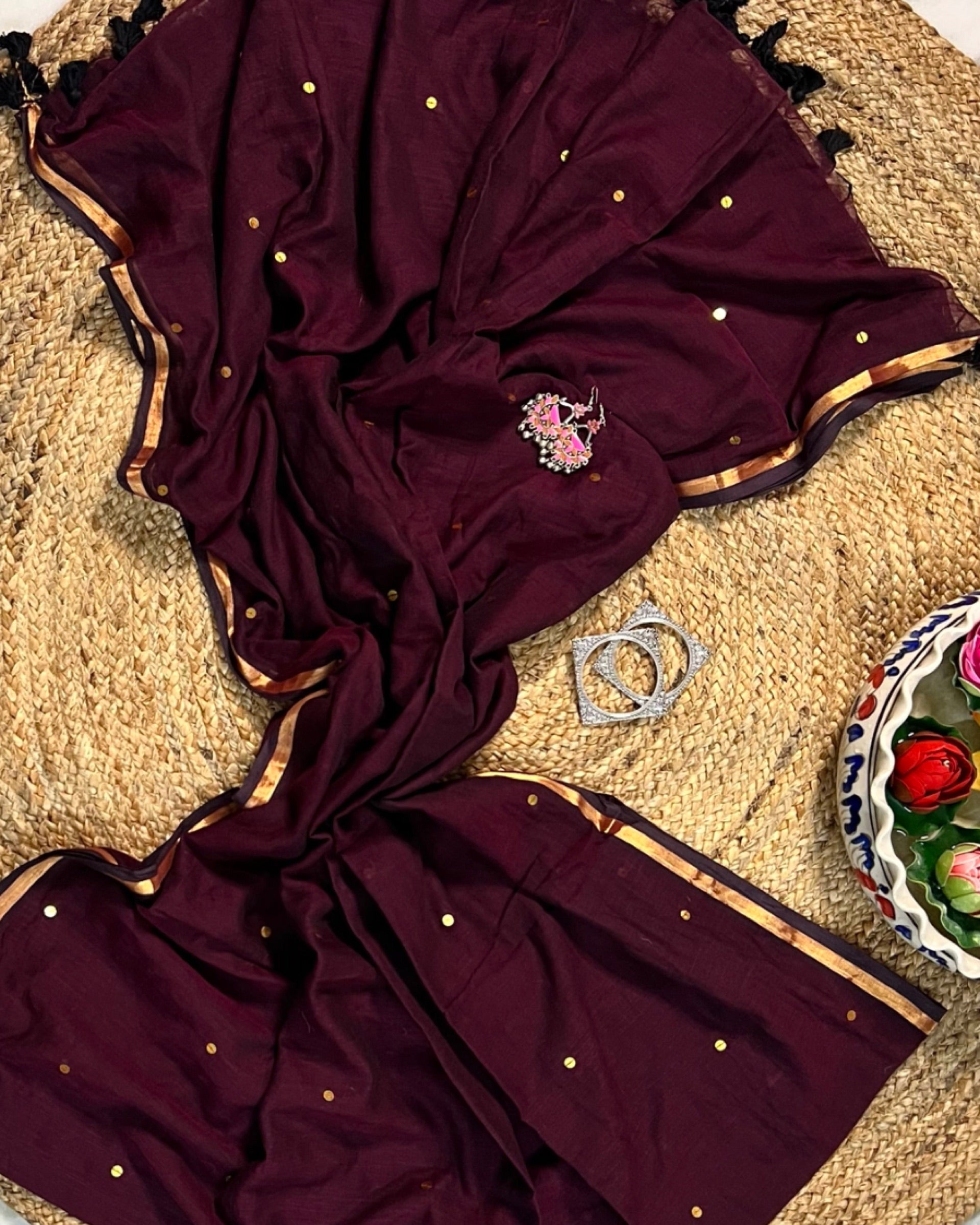 Soft and Comfortable mulmul cotton saree in maroon with golden sequin emblishment for festive or party wear at reasonable price