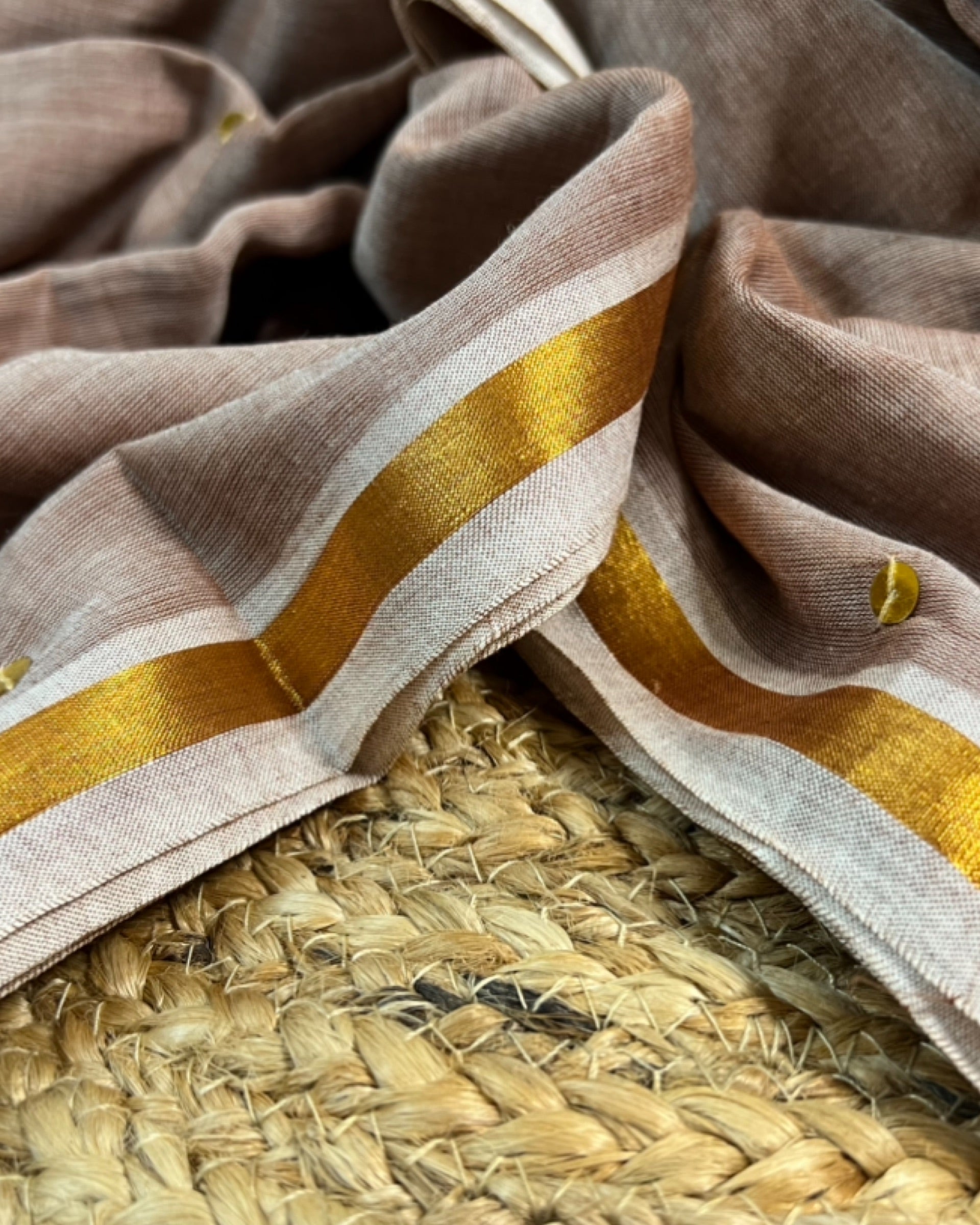 Soft and Comfortable mulmul cotton saree in beige off white brown shade with golden sequin emblishment for festive or party wear at reasonable price