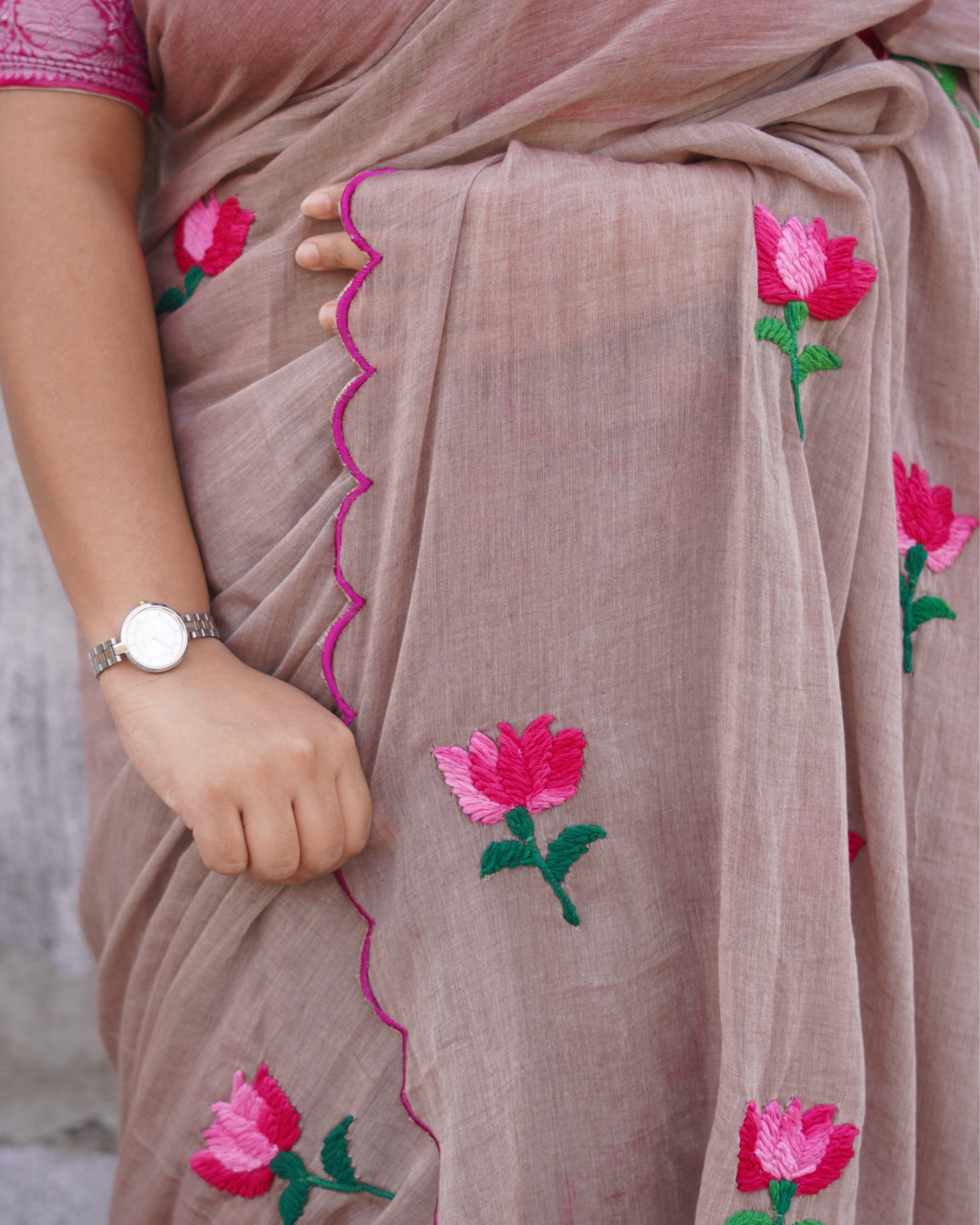 Lightweight embroidered mulmul cotton saree, designed for summer comfort with subtle elegant detailing.