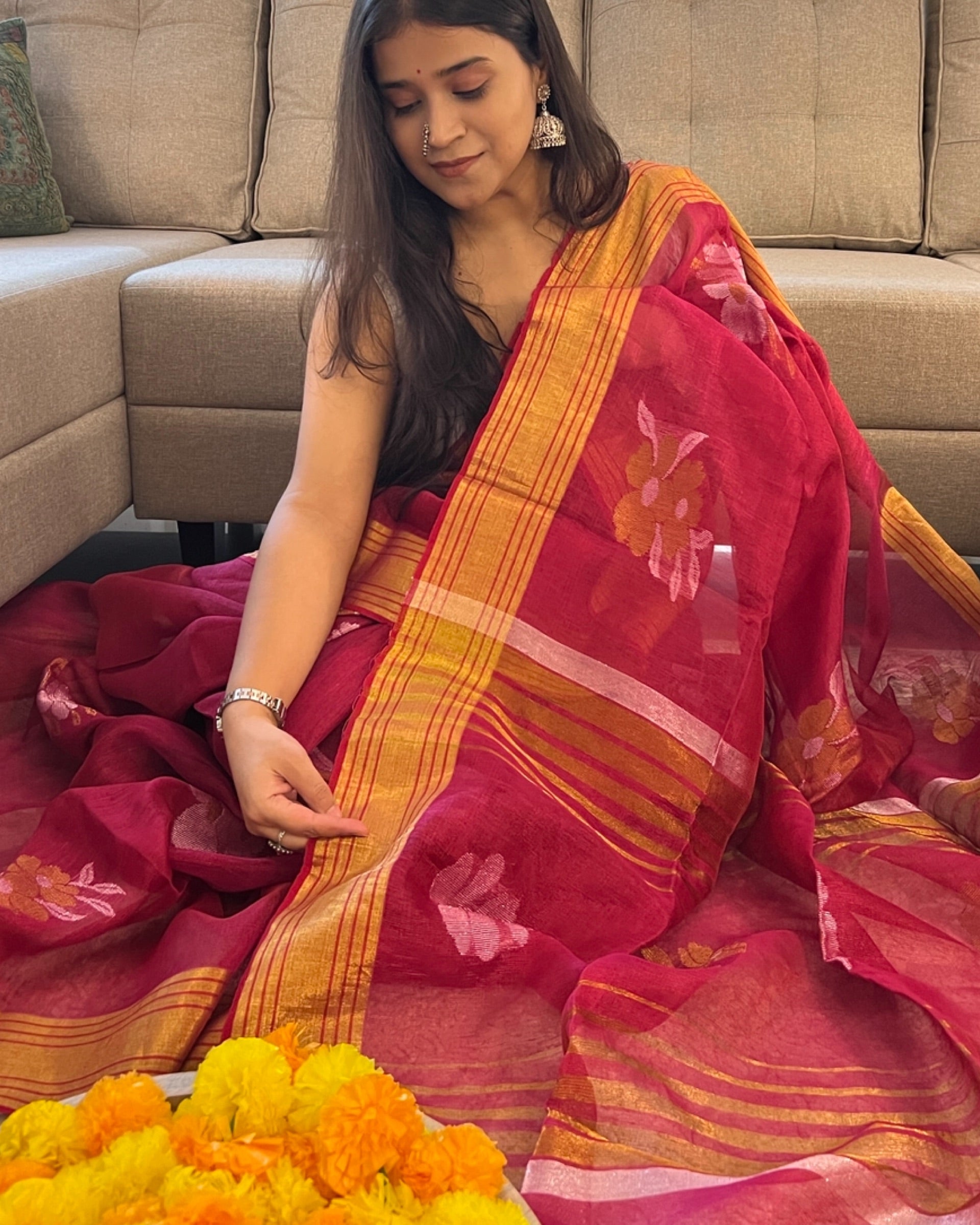 Manmohini tissue saree featuring elegant red golden tones for special occasions