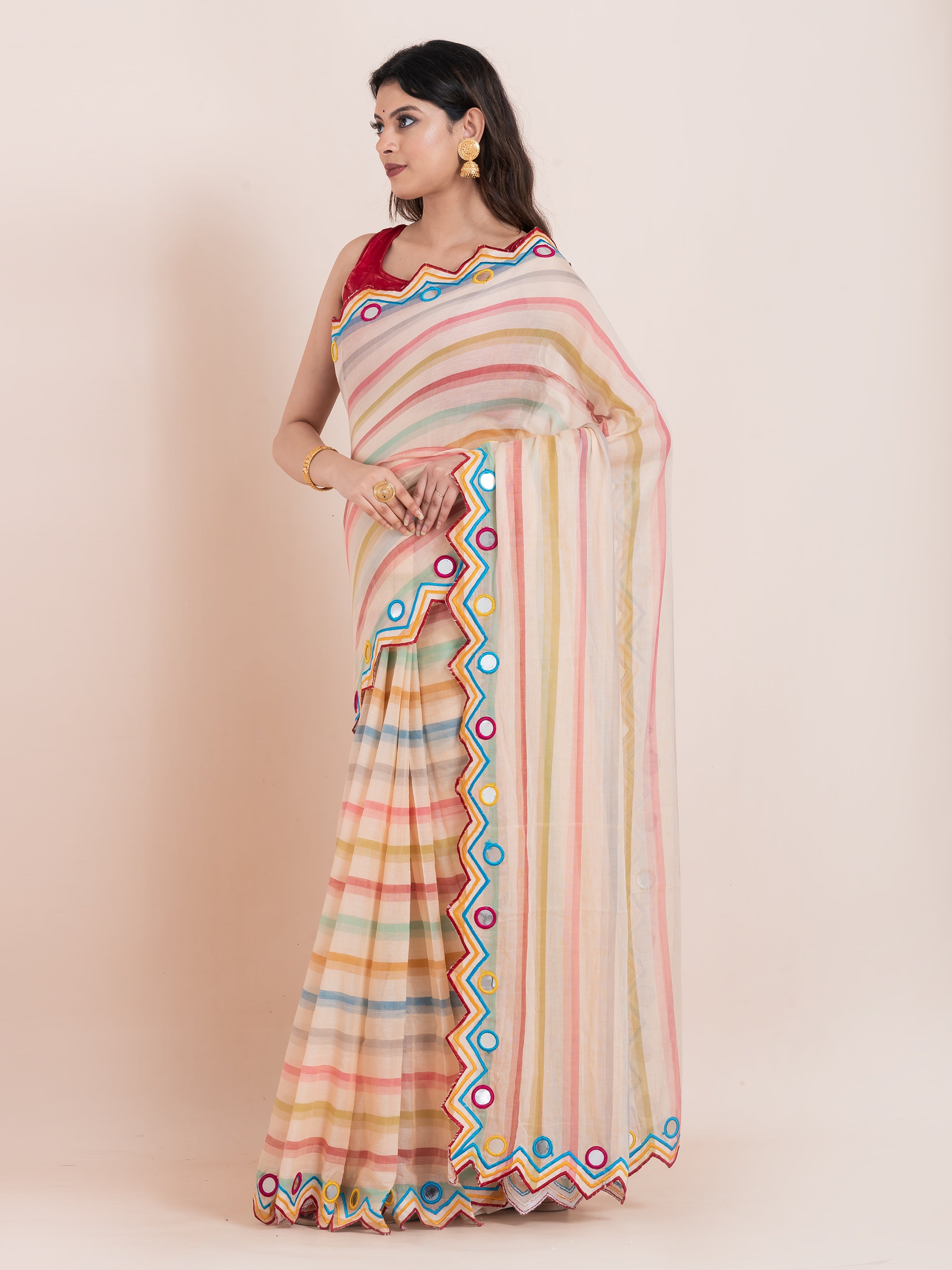 Lightweight peach mulmul cotton Shopaame saree with mirror embroidery and multicolored stripes. Perfect for summer wear and effortless elegance.