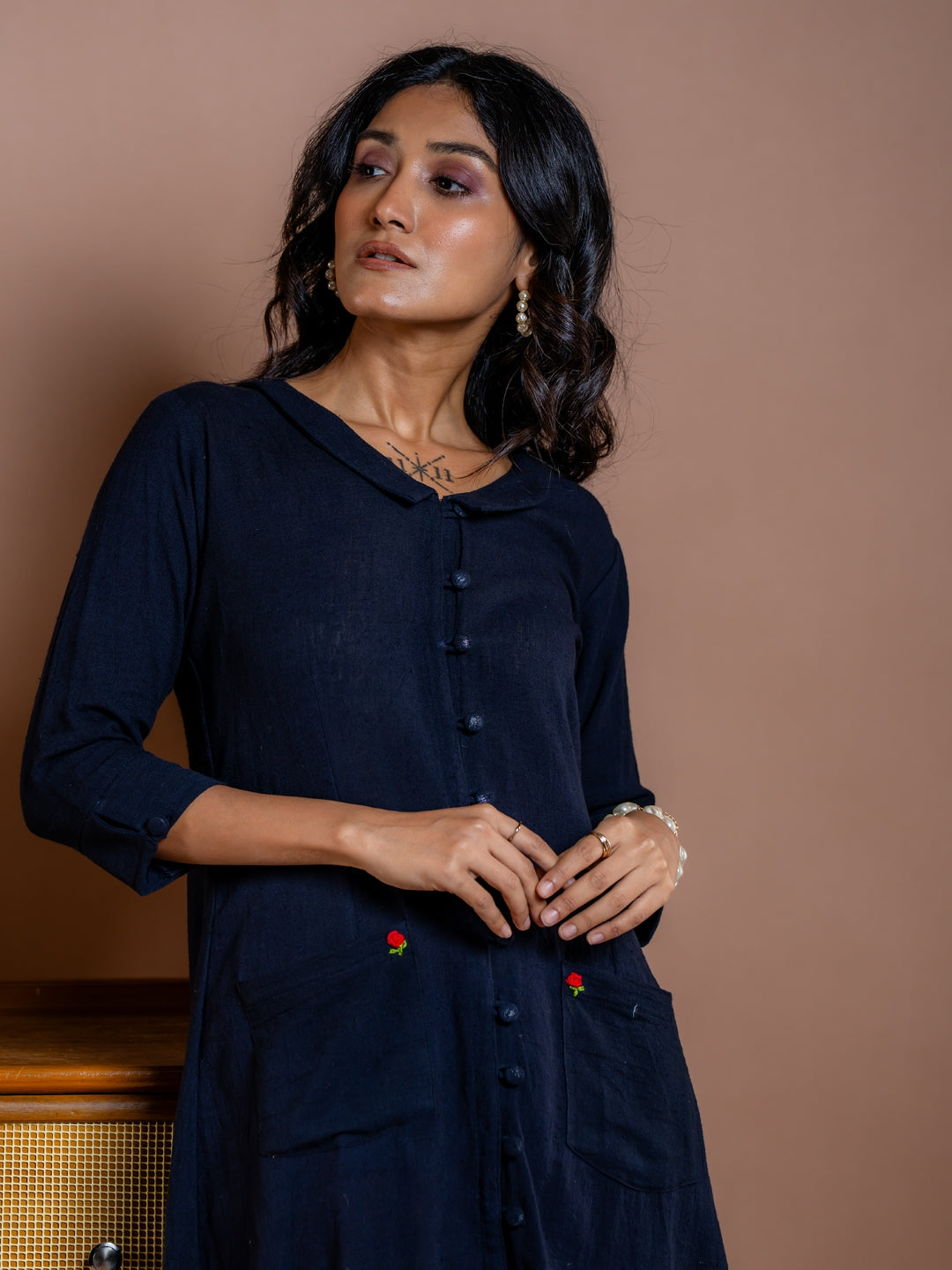 Embroidery detail of our Noir Fern black handwoven summer cotton dress in A-line silhouette is a must have tunic dress for every wardrobe. Sustainably made in India. Free shipping across India. We ship worldwide.