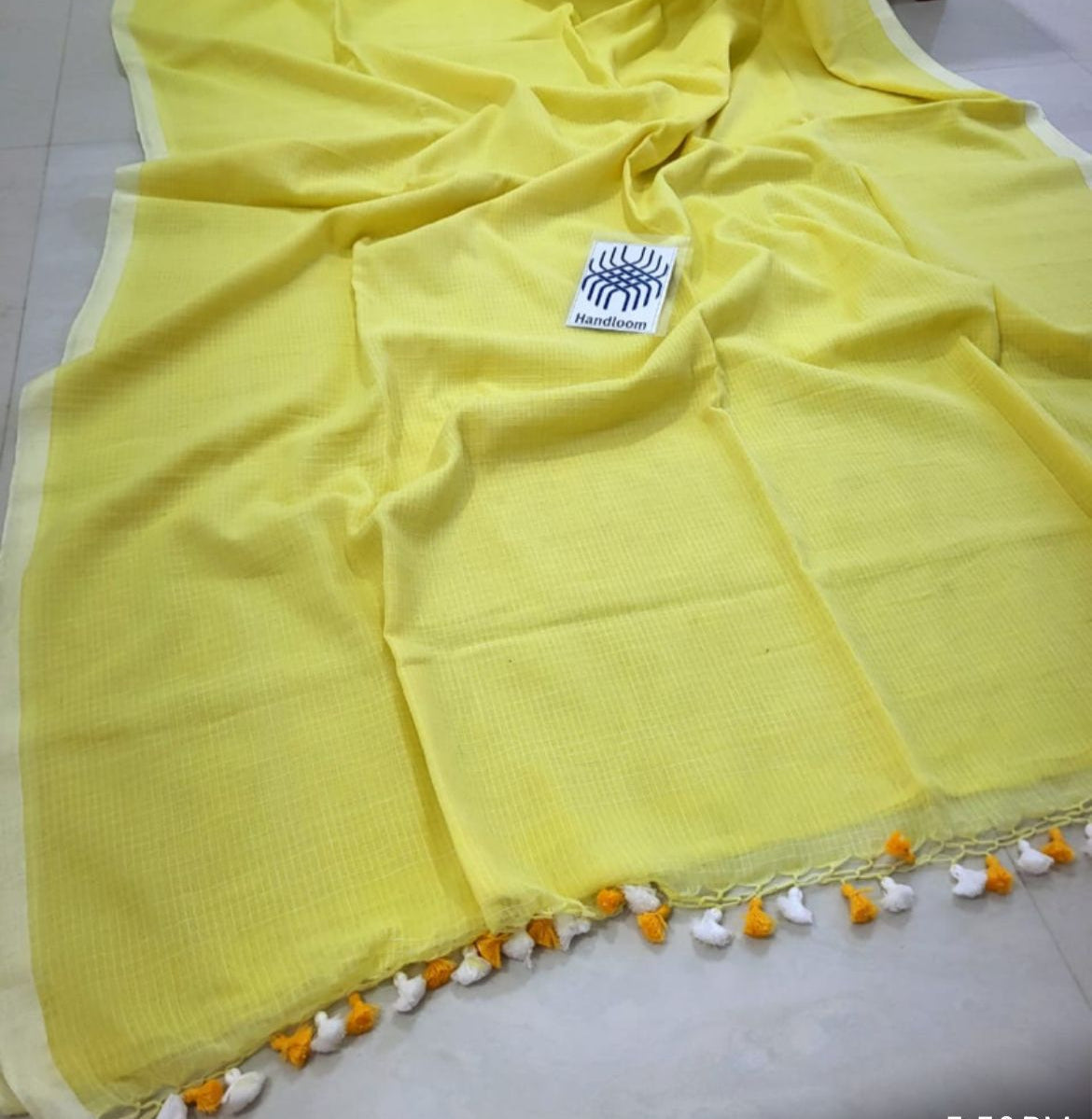 handcrafted yellow handloom cotton saree designed for office wear with a clean and elegant look