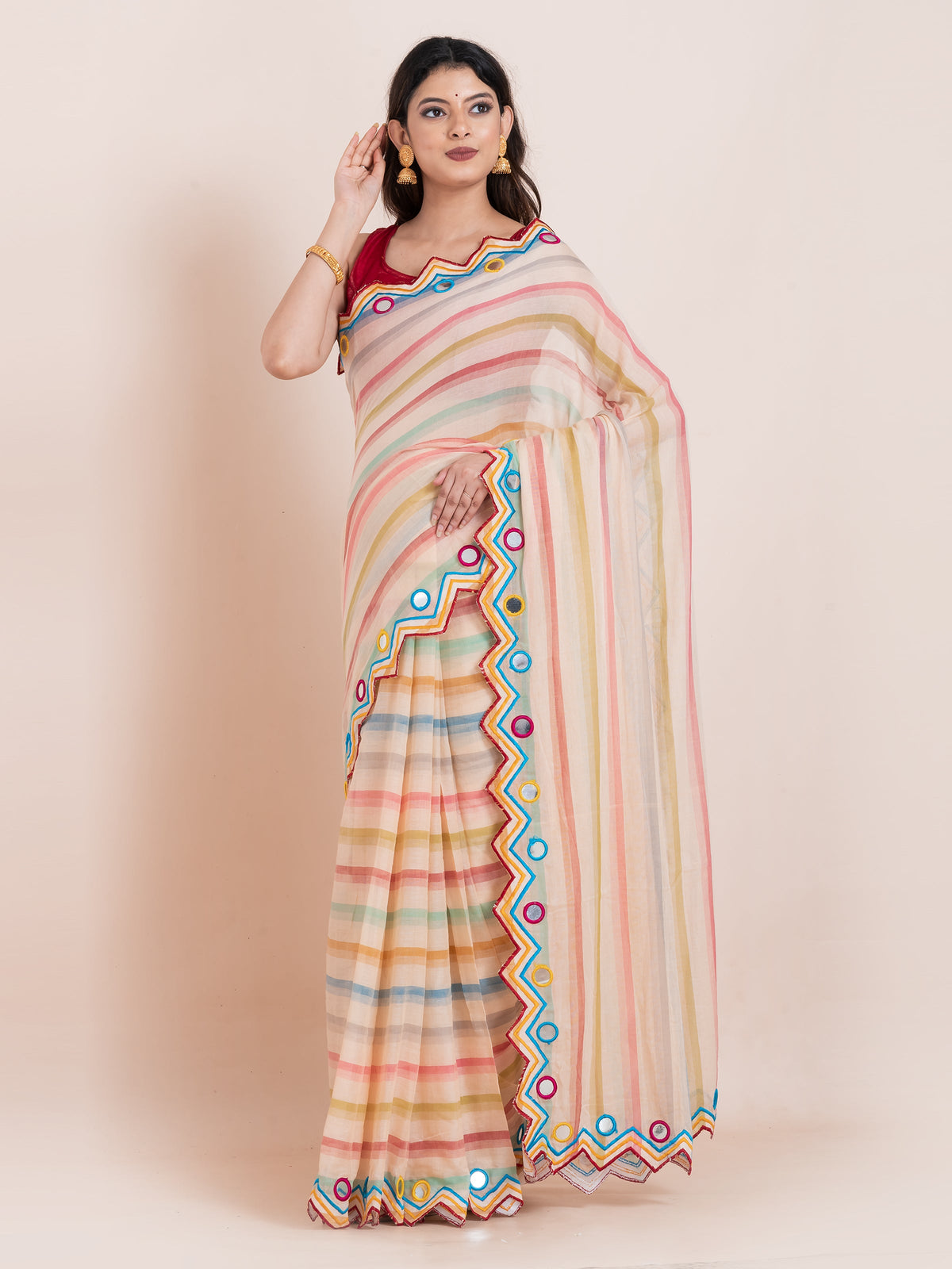 Lightweight peach mulmul cotton saree by Shopaame with mirror embroidery and multicolored stripes. Perfect for summer wear, festive looks and effortless elegance.