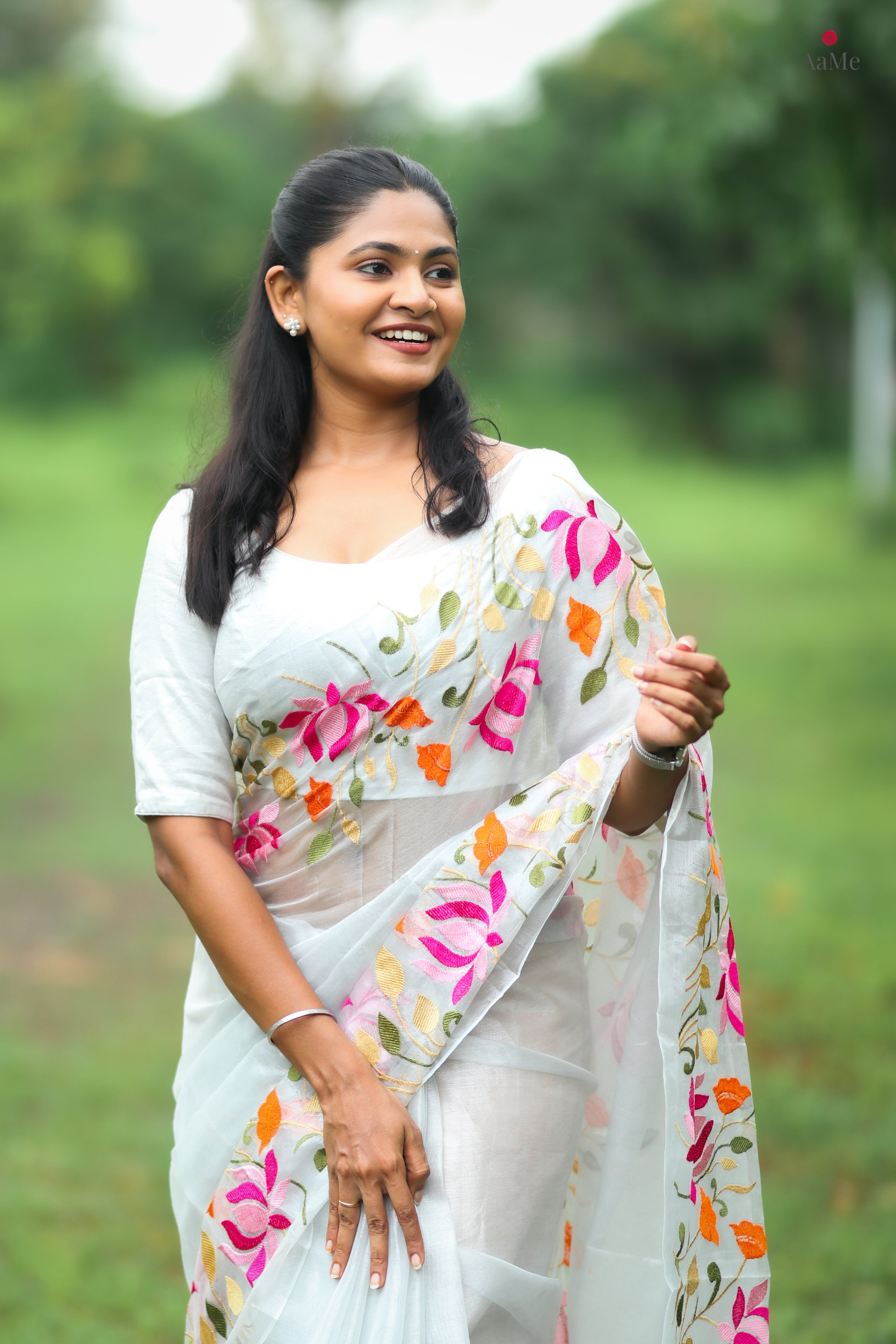 Silver white viral tissue saree with floral embroidery orange and pink