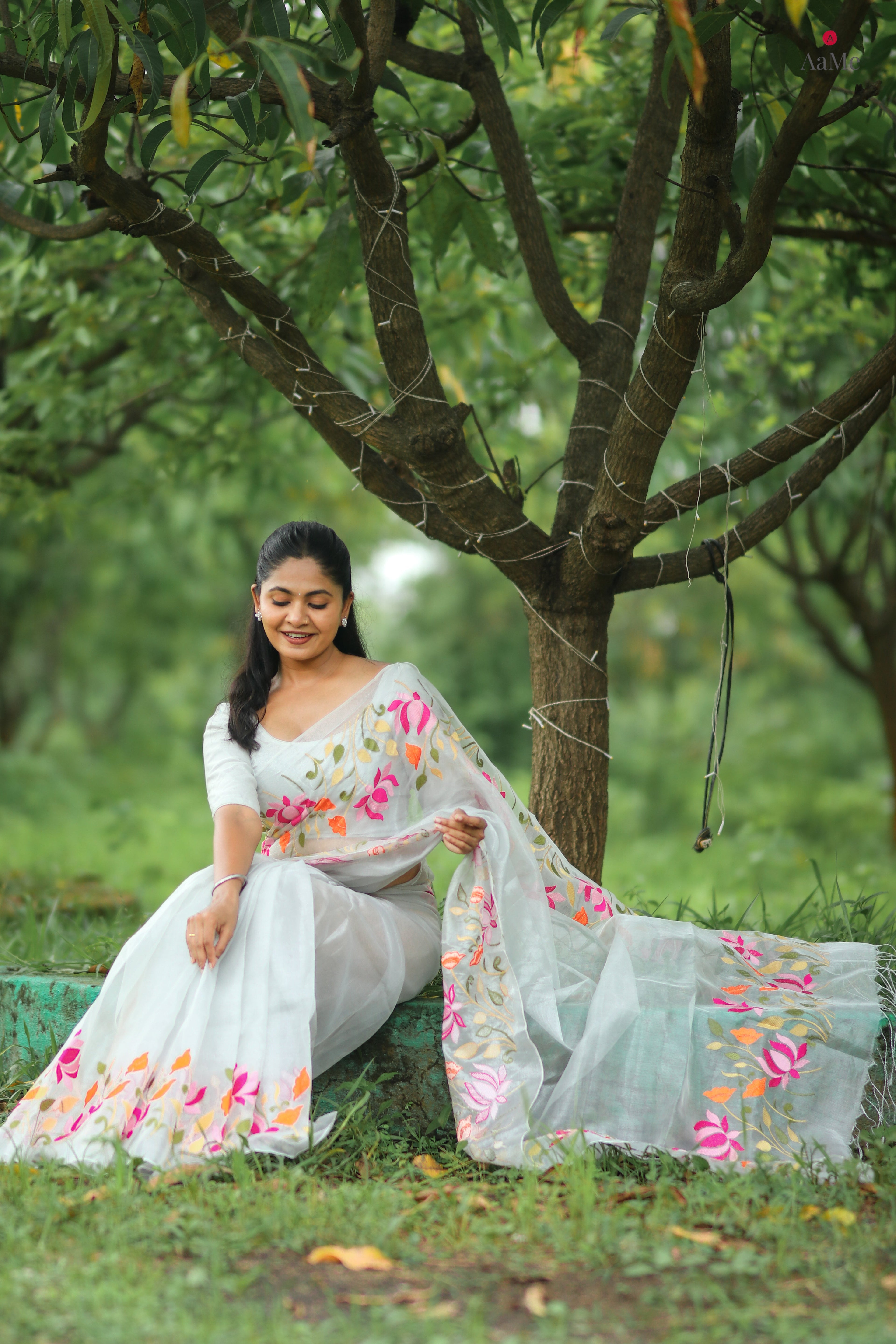 Silver white tissue saree by ShopAaMe with floral embroidery orange and pink