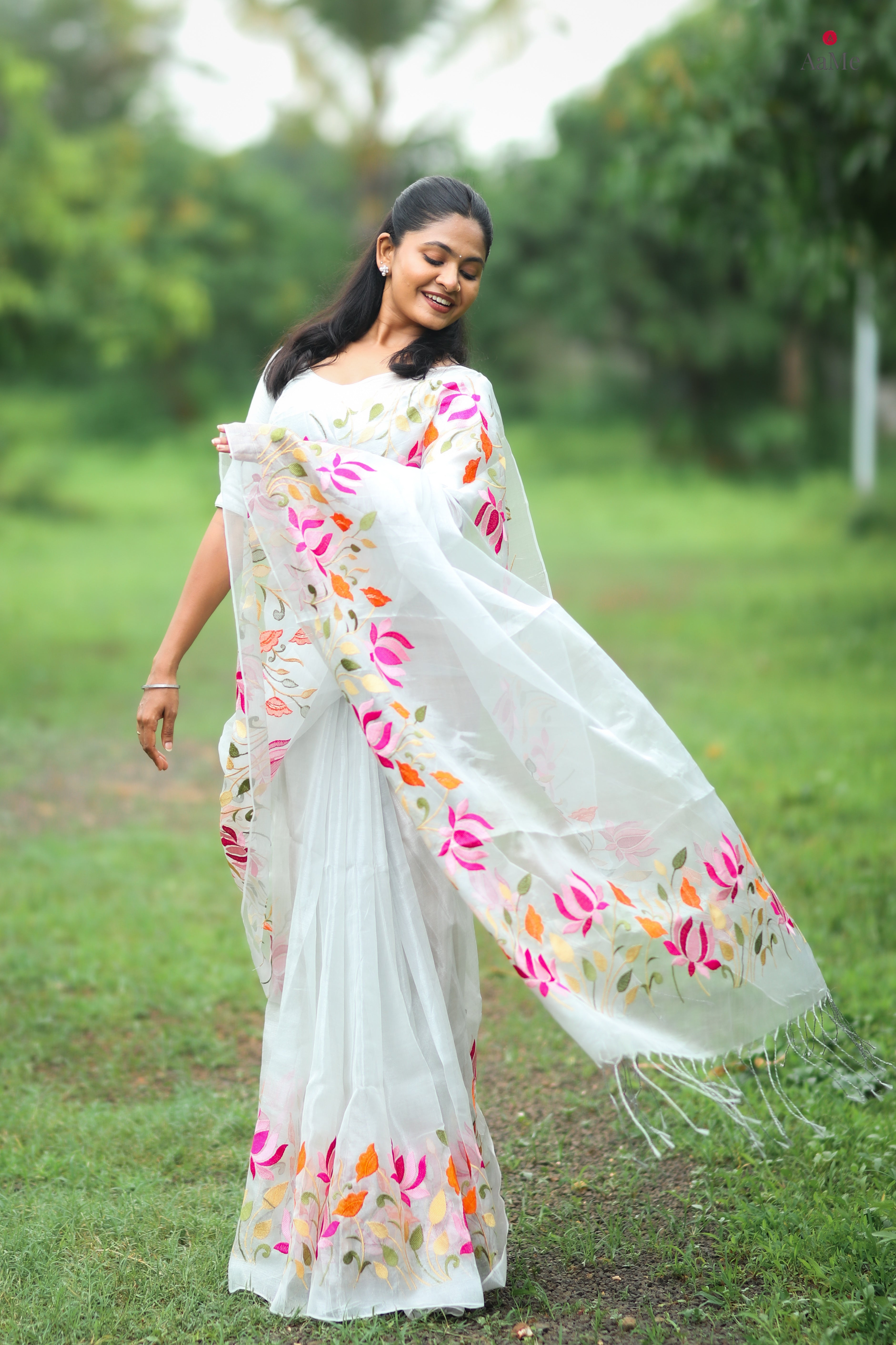 White tissue saree with lightweight festive drape by Shop AaMe