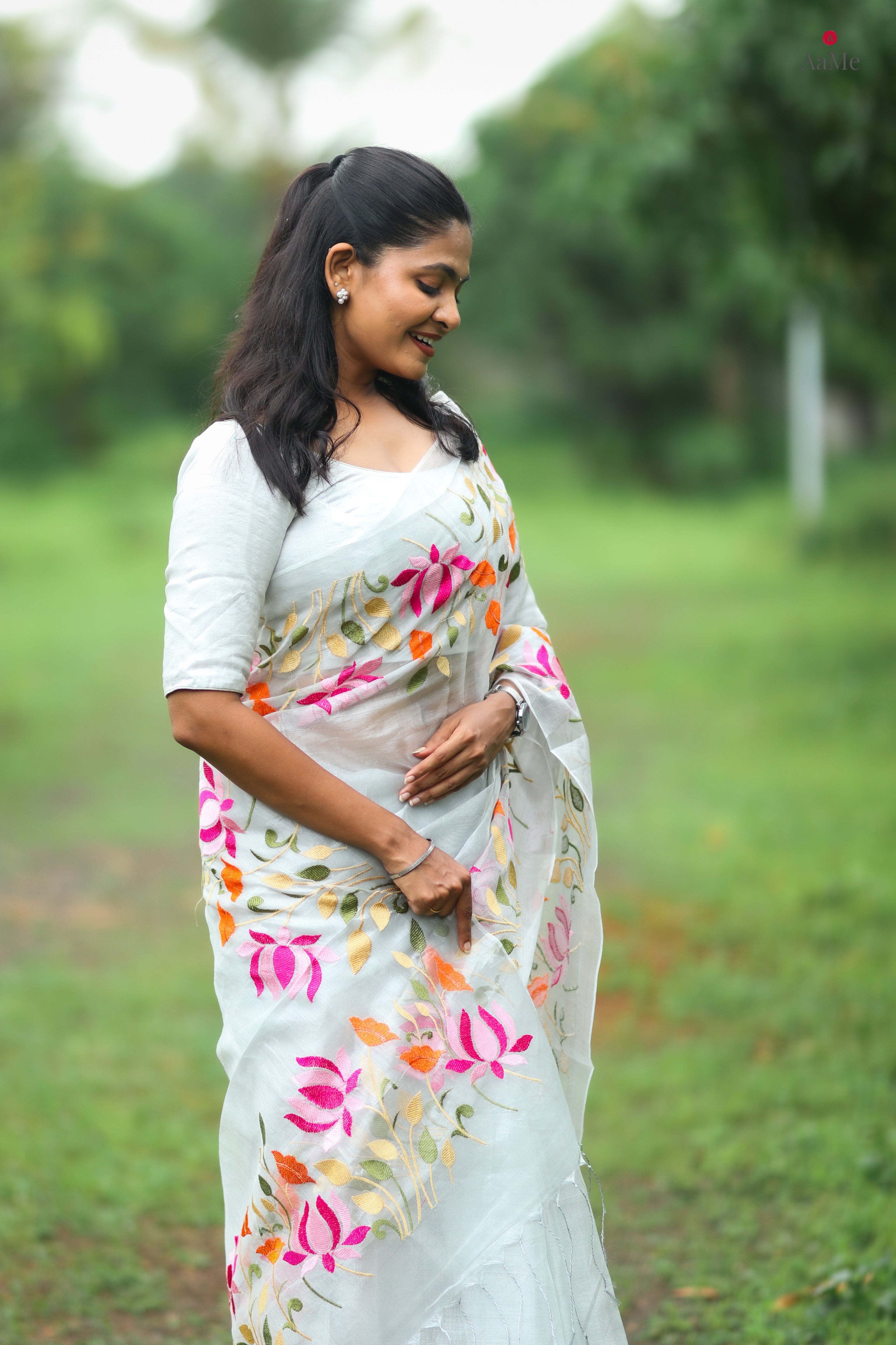 Silver white viral tissue saree with floral embroidery orange and pink