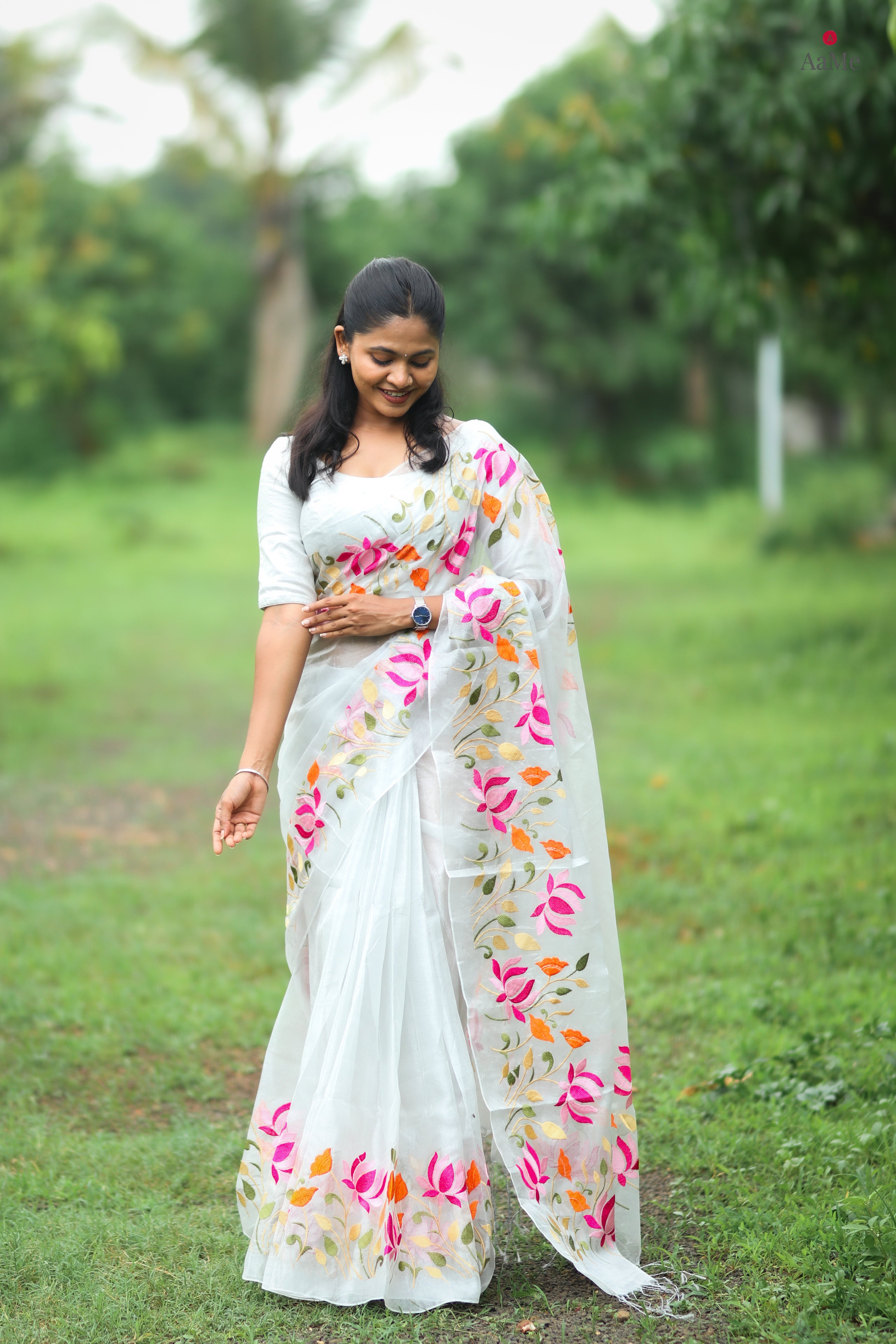 Silver white tissue saree by Shopaame with floral embroidery orange and pink