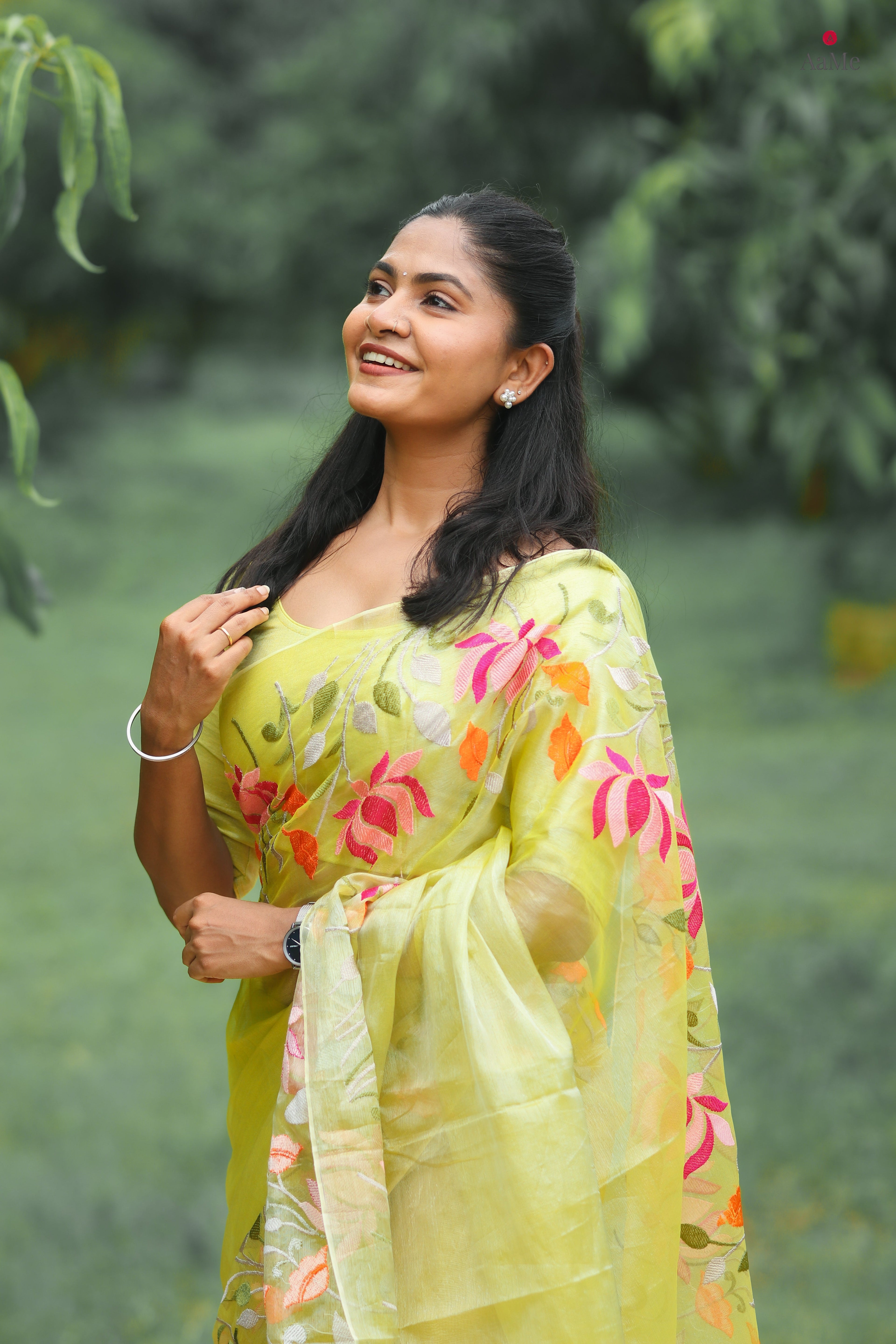 Yellow tissue saree by Shopaame with floral embroidery orange and pink