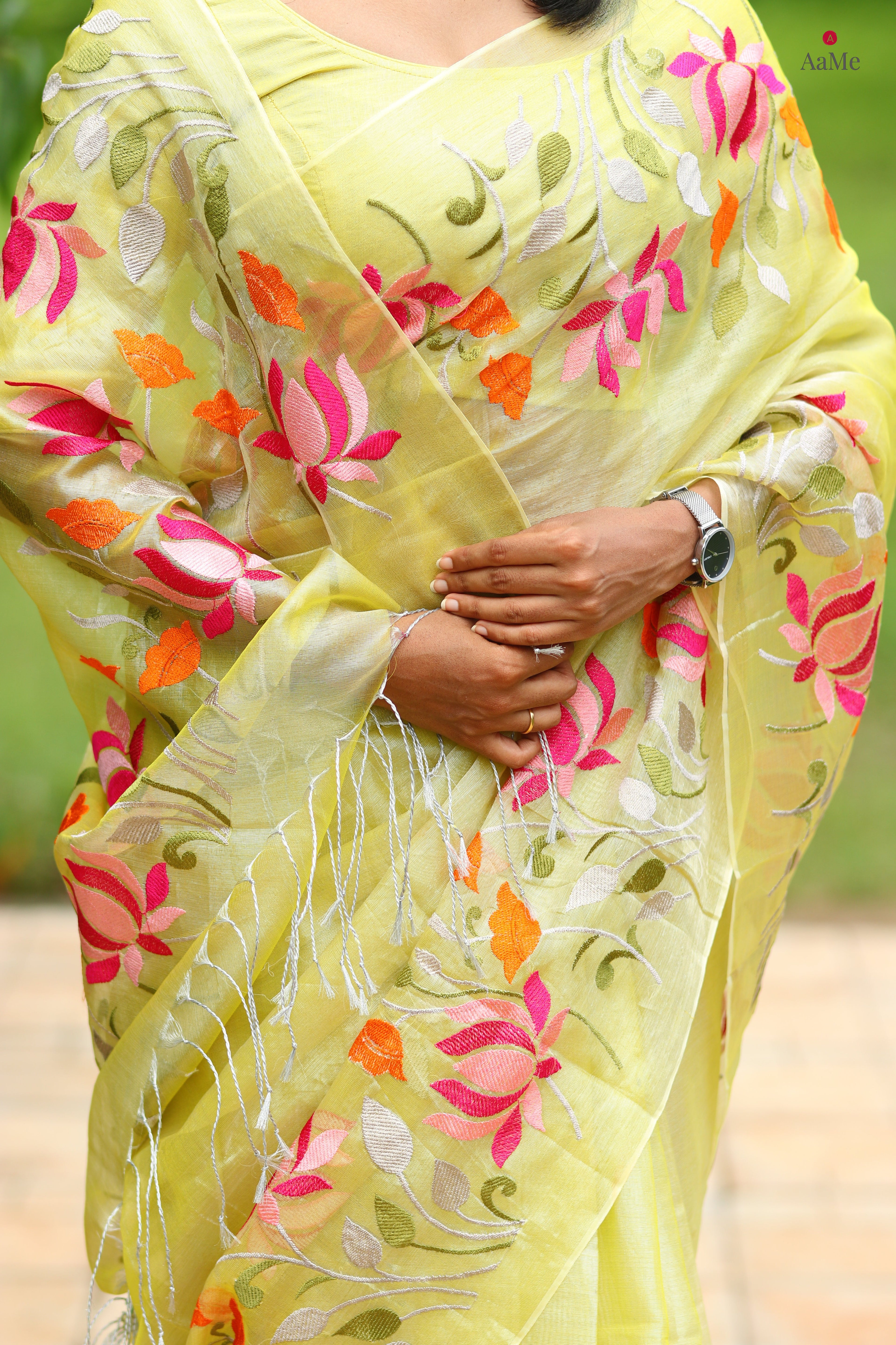 Yellow viral tissue saree with floral embroidery orange and pink