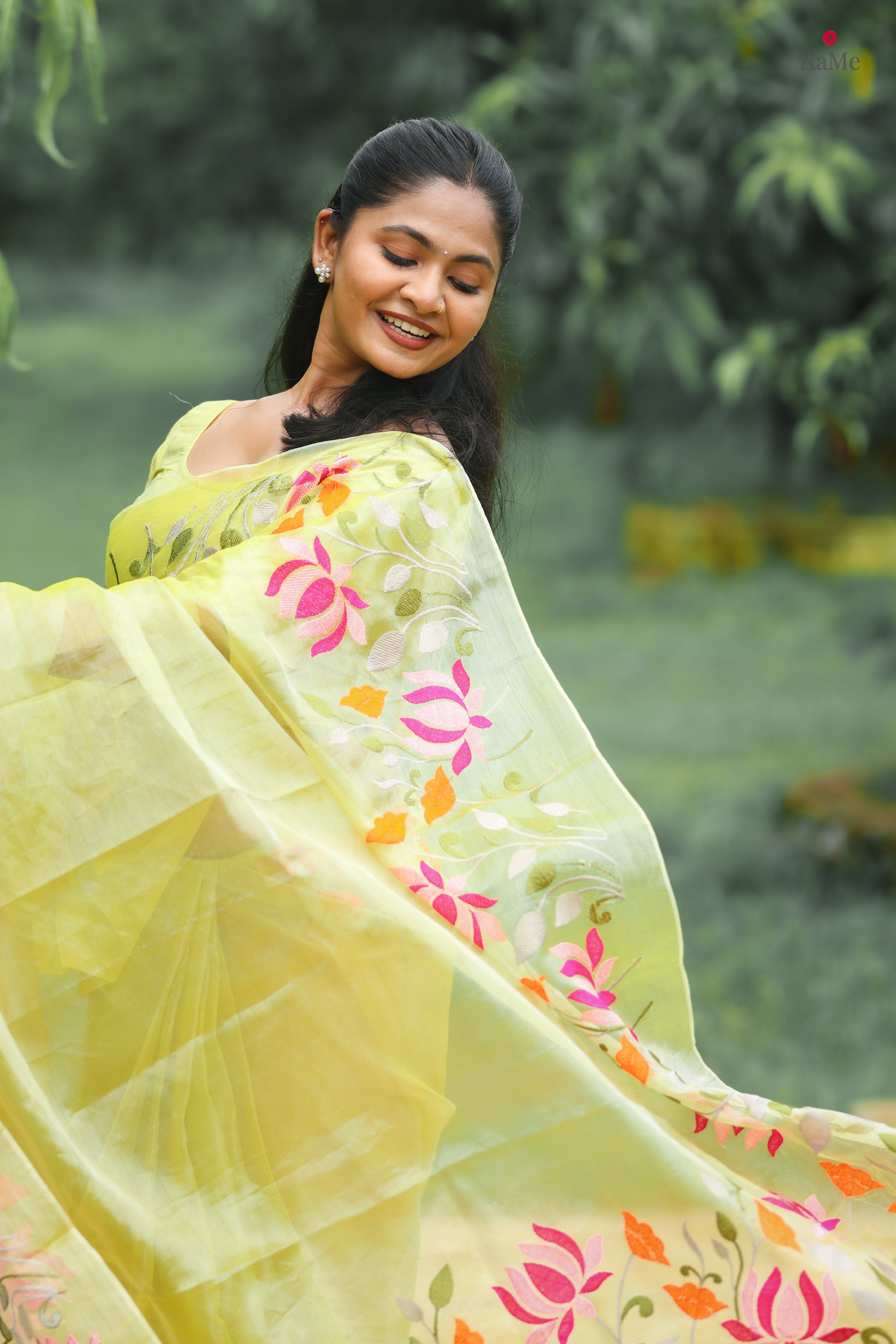 Yellow viral tissue saree with floral embroidery orange and pink