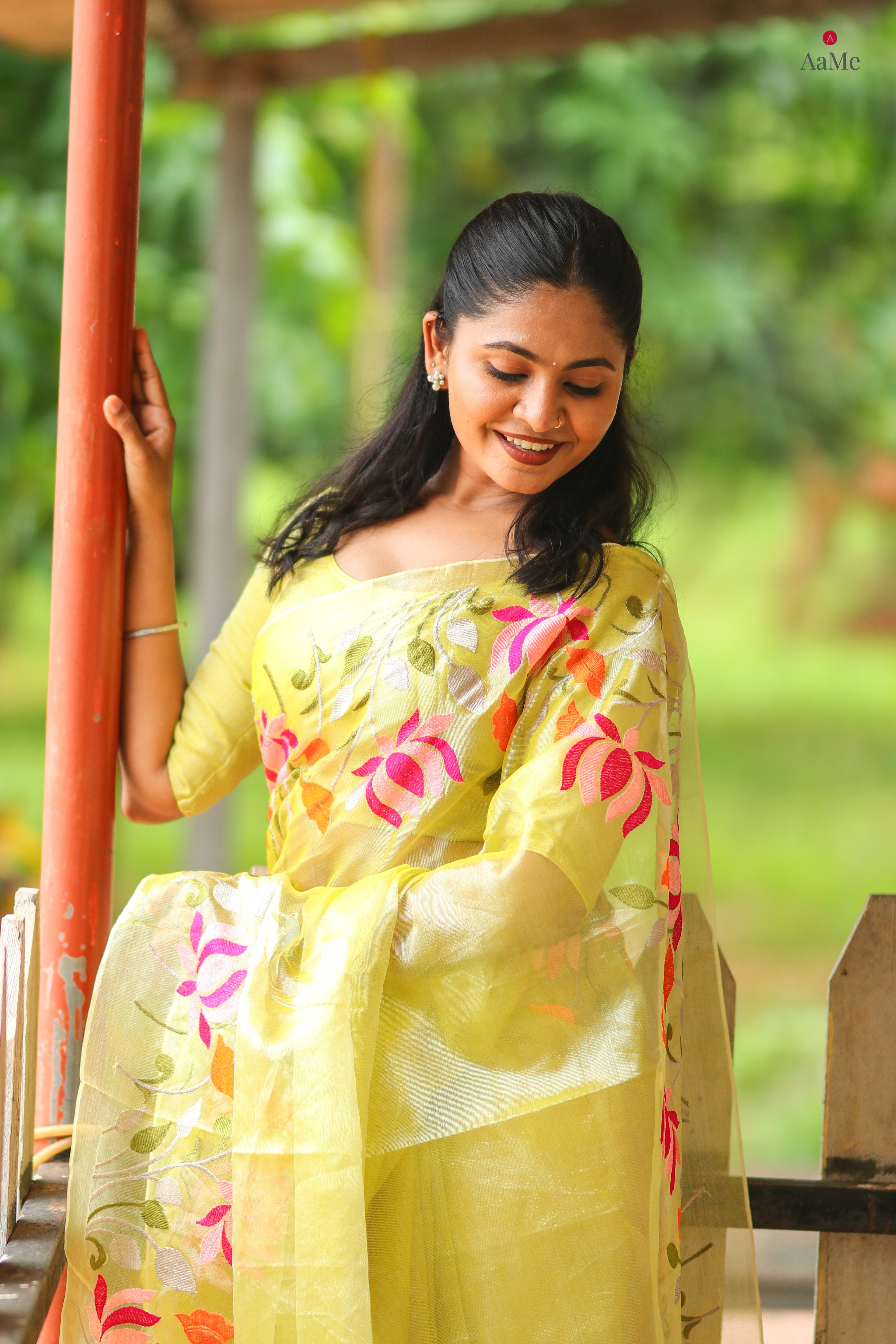 Yellow viral tissue saree with floral embroidery orange and pink