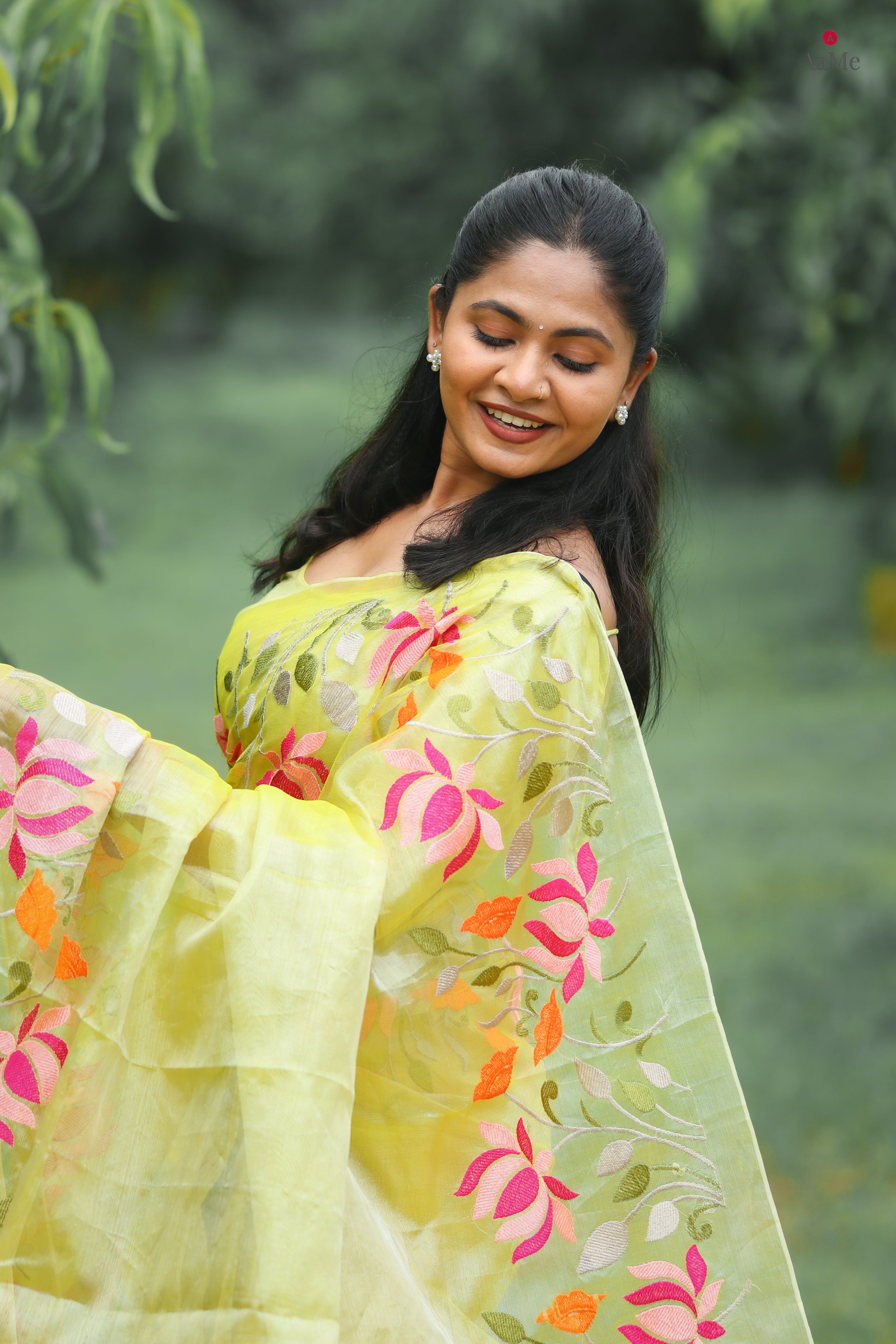Yellow viral tissue saree with floral embroidery orange and pink