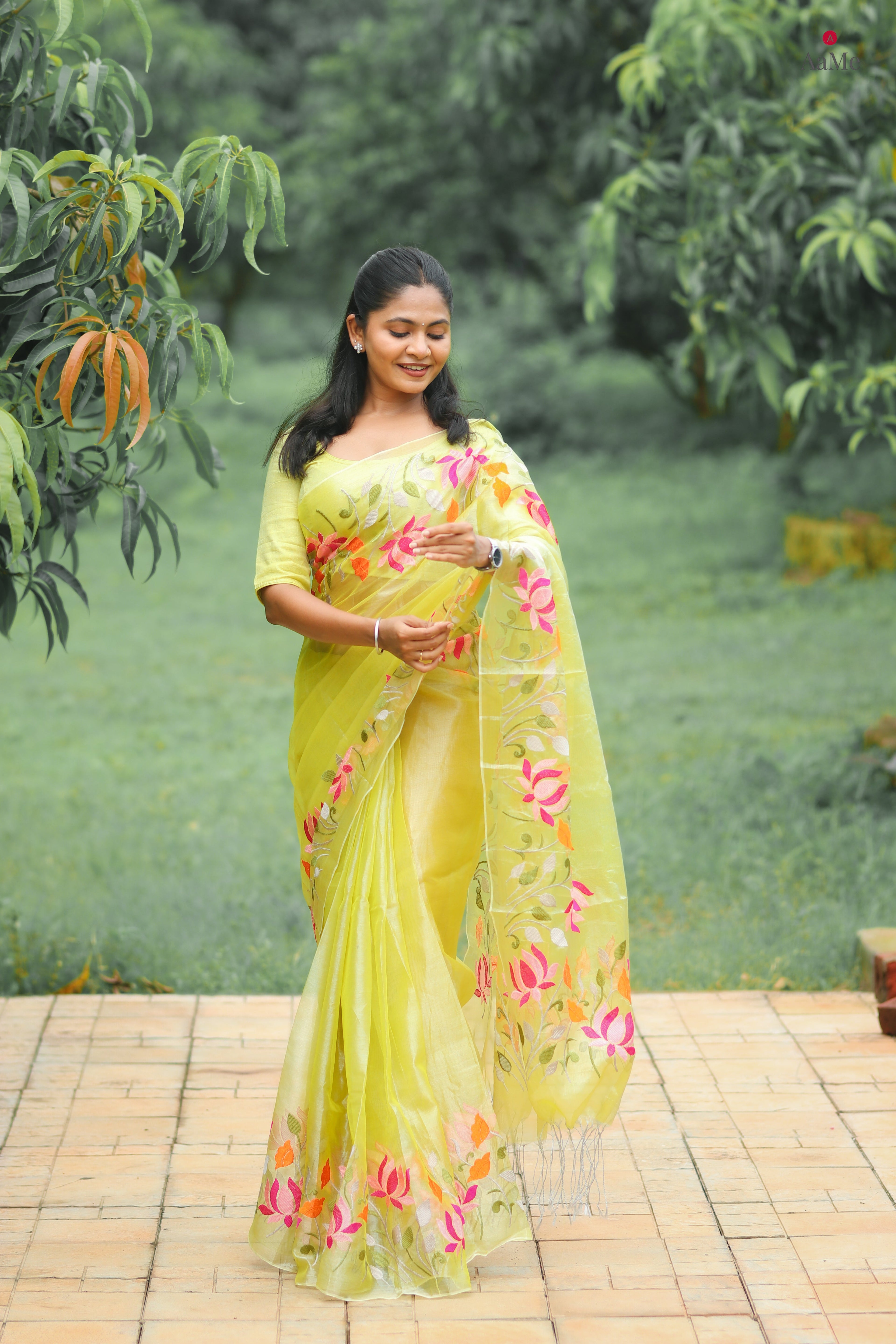 Yellow viral tissue saree with floral embroidery orange and pink