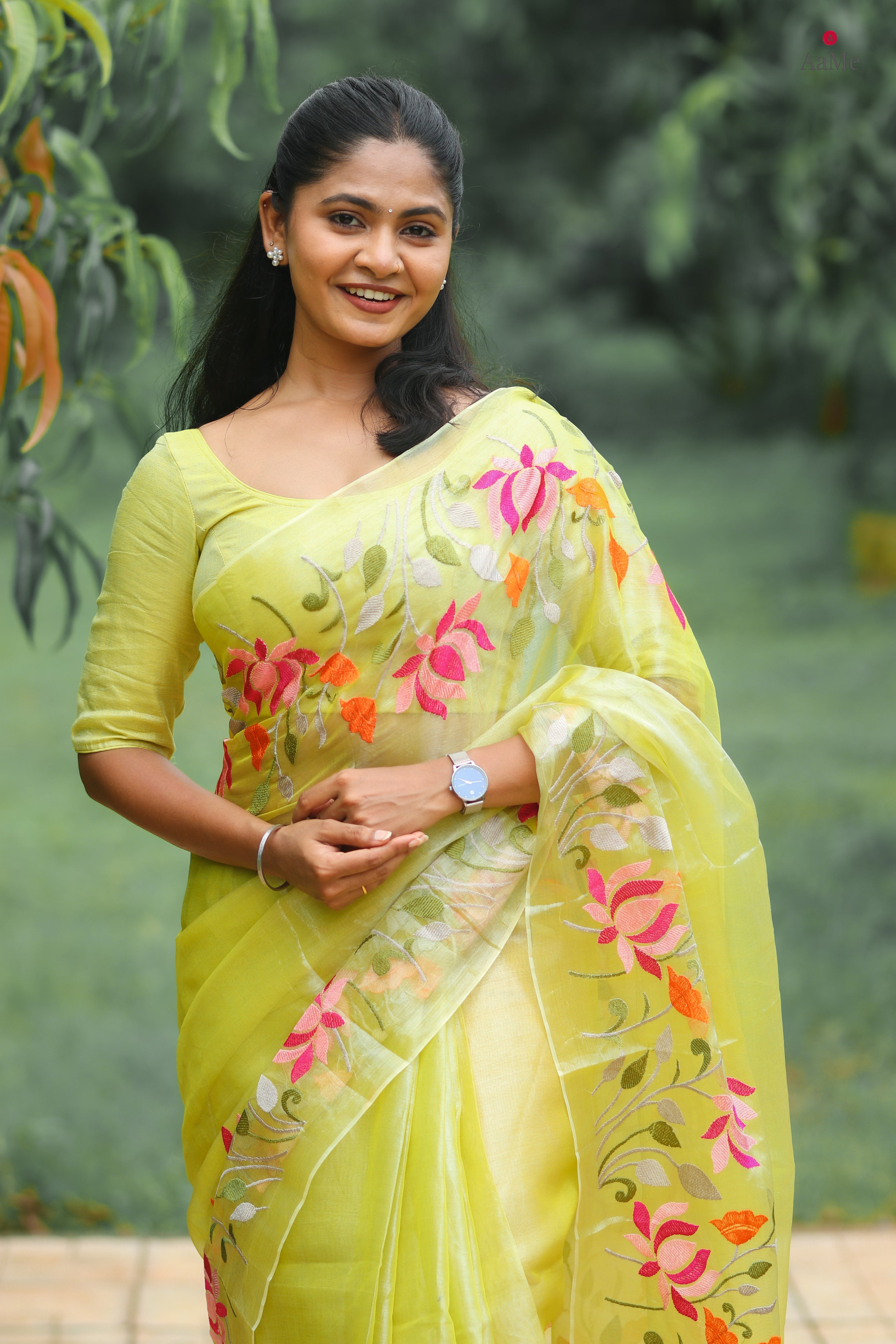Yellow viral tissue saree with floral embroidery orange and pink