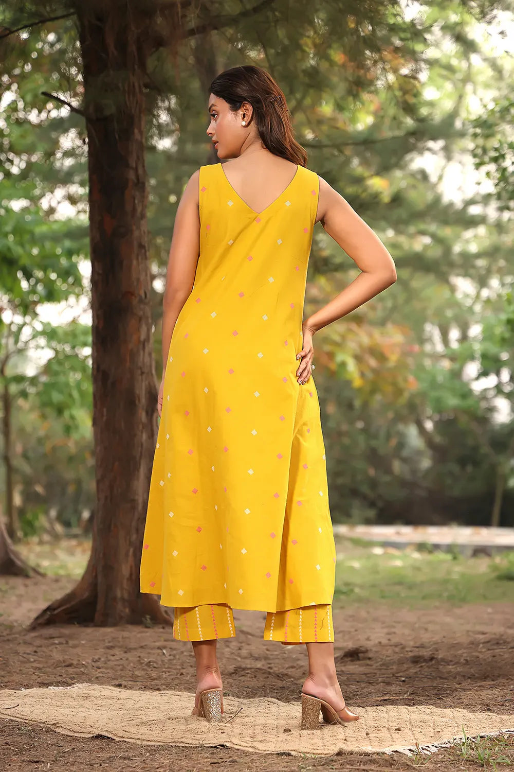 Back View of Yellow Pure Cotton Kurta Pant Set with Woven Pink White Motifs
