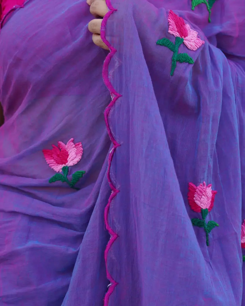 Lotus Dew purple mulmul cotton saree, handcrafted with lotus motifs for a breathable and graceful everyday look.