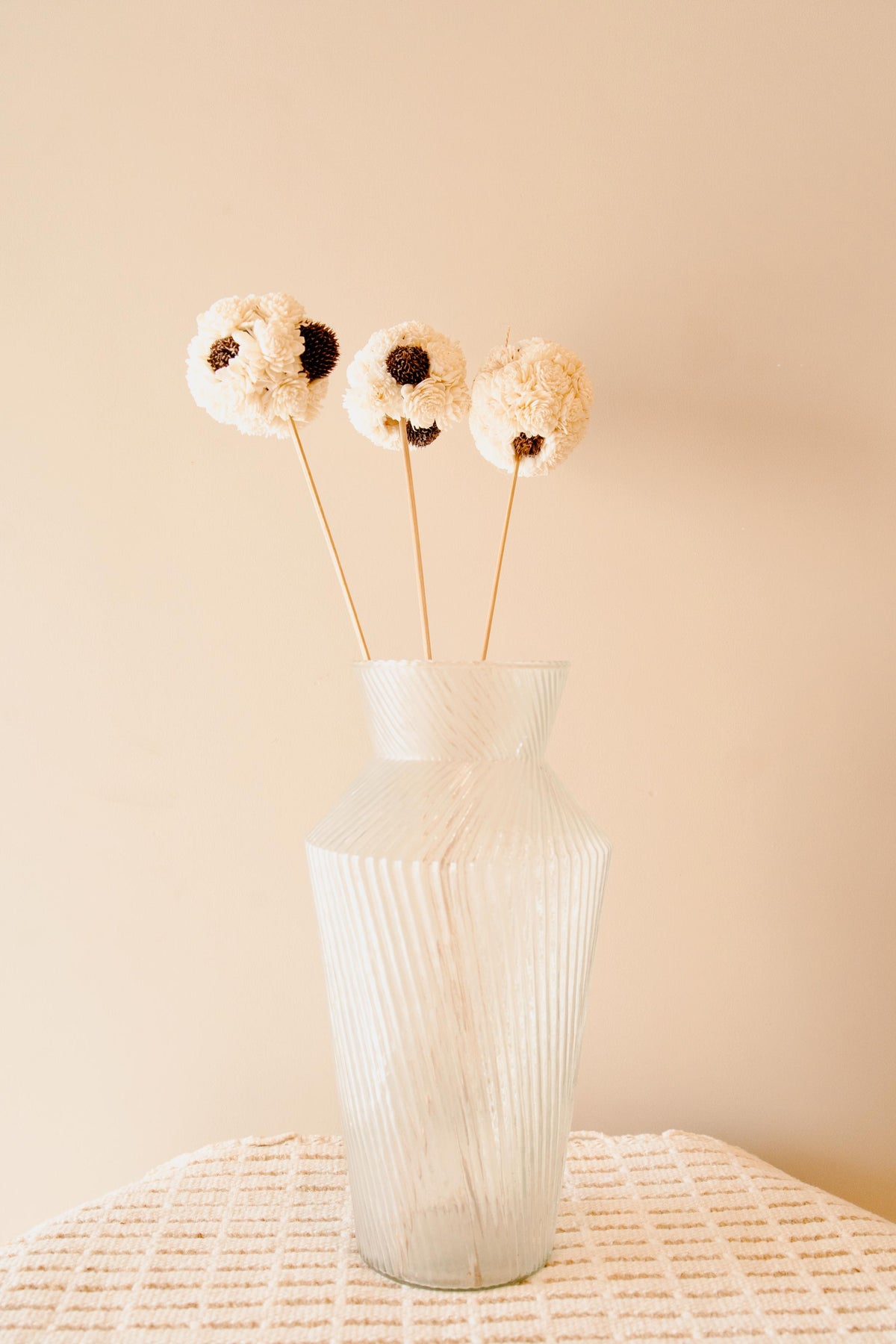 Handmade white sola flower ball sticks used for aesthetic home decor and elegant interior styling