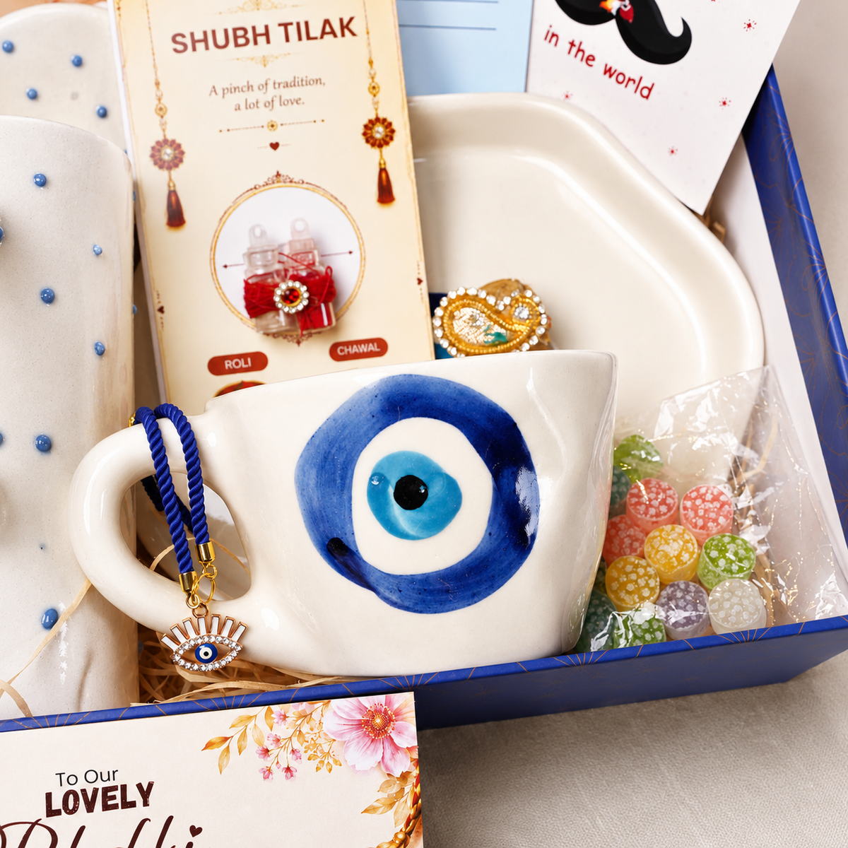 Artecasa Nazar Se Surakshit Rakhi Hamper | Evil Eye Rakhi Gift for Brother & Bhabhi - https://artecasa.in/
