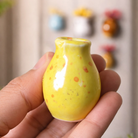 Colorful ceramic fridge magnets with dried florals