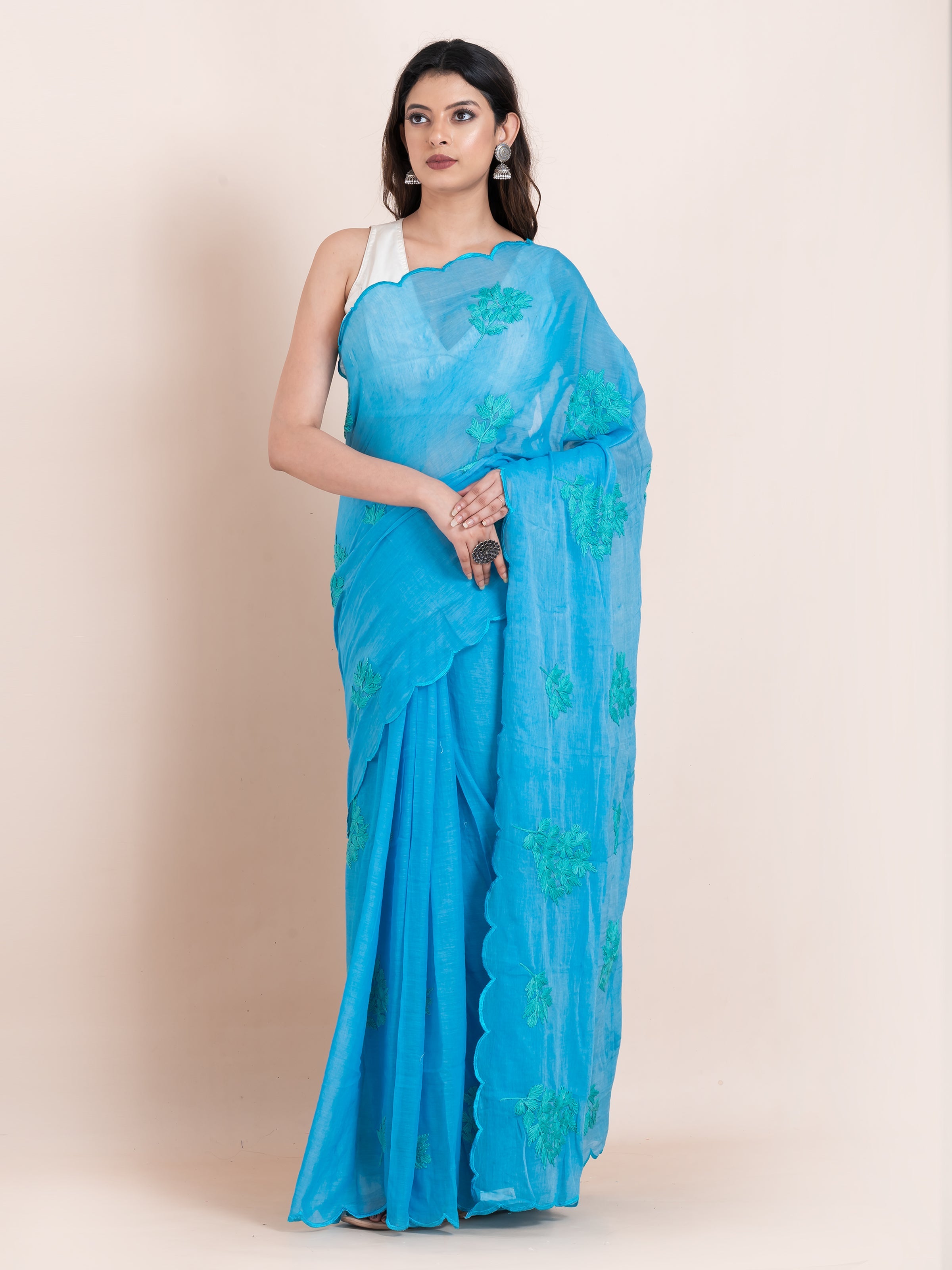 Blue mulmul cotton saree with chikankari embroidery, soft airy elegance for summer styling and festive moments.