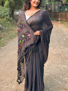 Noir Petal Nocturne black embroidered mulmul saree with elegant handcrafted detailing