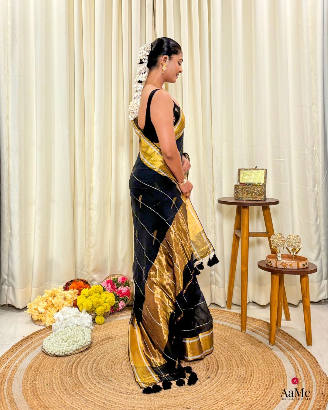 Women wearing soft black mulmul saree in breathable cotton, perfect for elegant evening celebrations